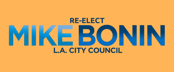 Campaign sign that says "Re-elect Mike Bonin L.A. City Council" on an orange background with blue and dark blue text.