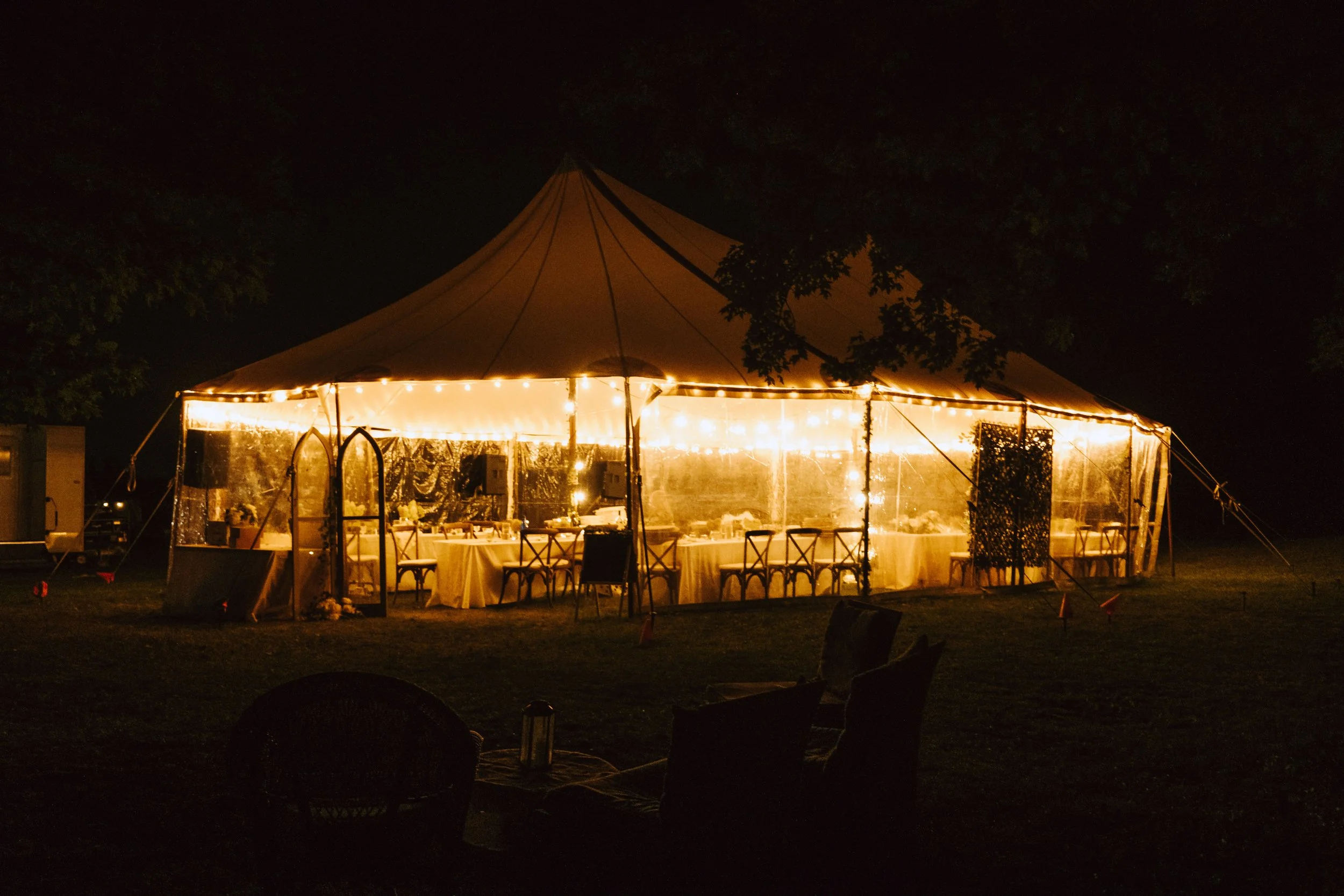 Image of a brightly lit up tent at night time