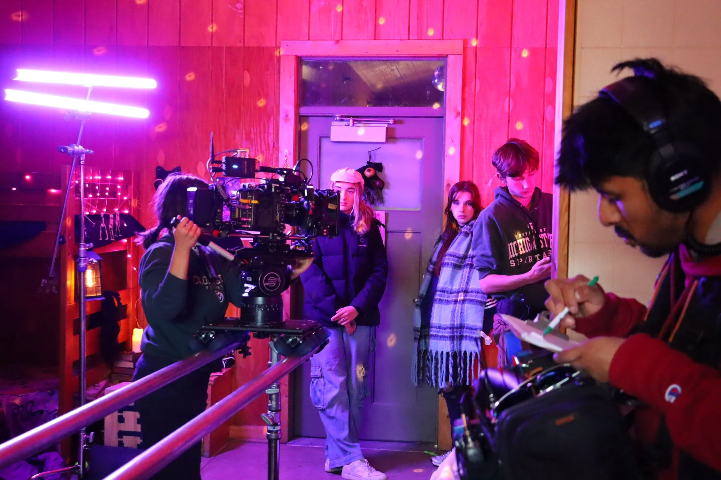 Crew working on a dolly shot inside the picture cabin 