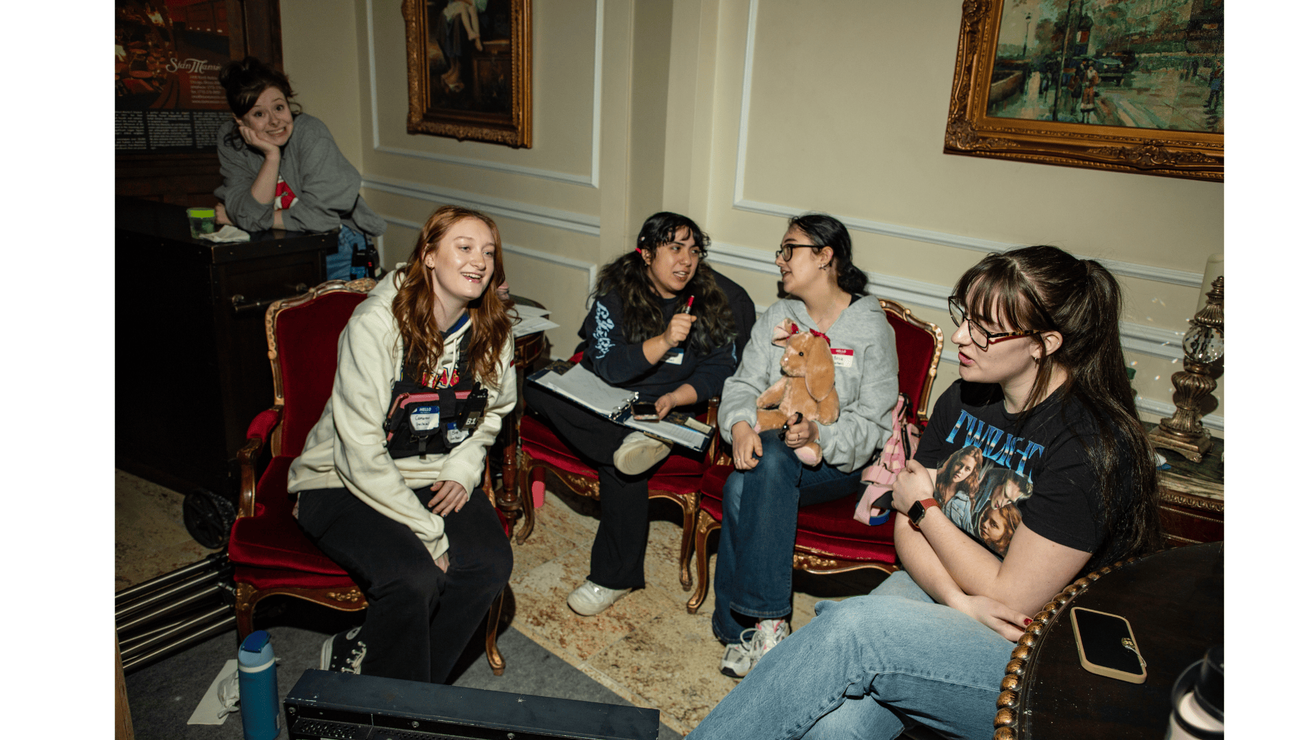 Some HOD's talking by monitor in-between set ups 