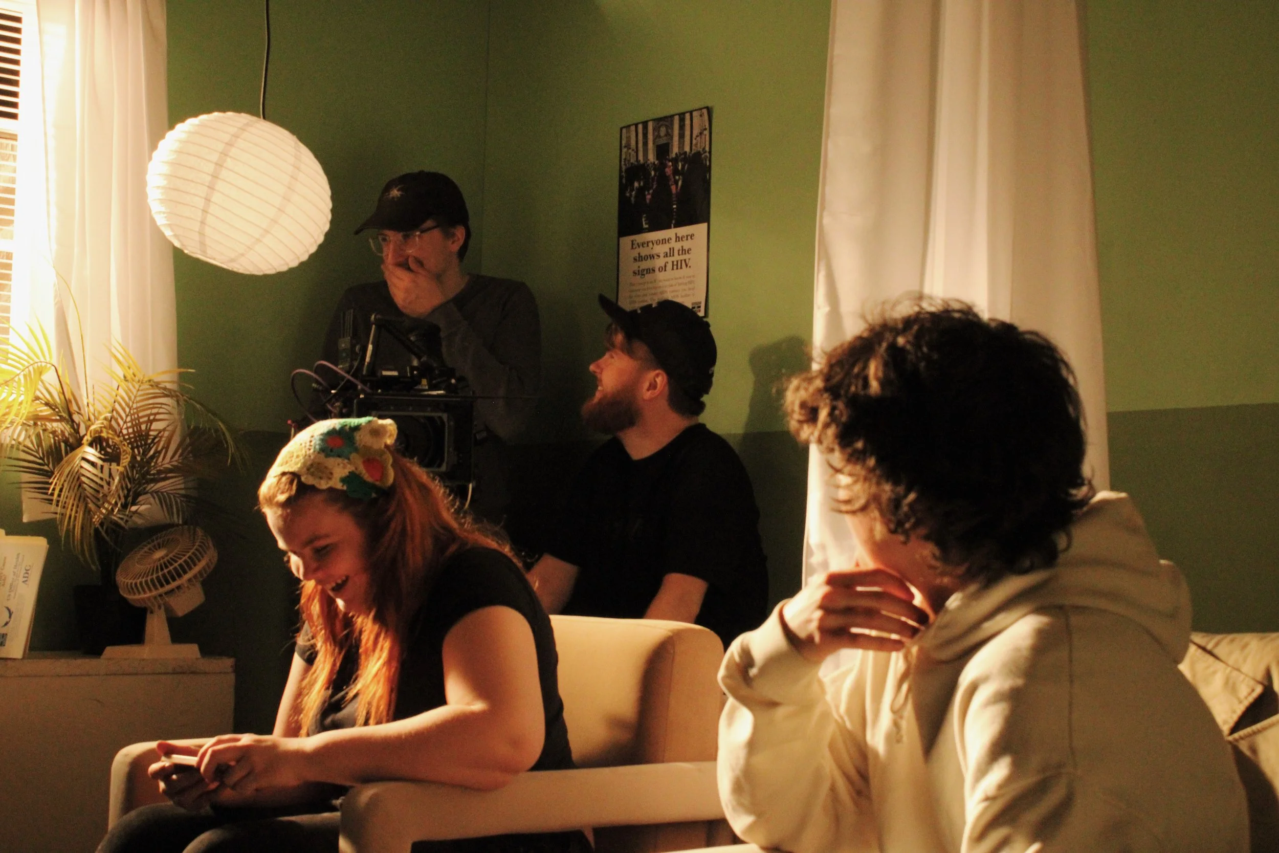 Camera and G+E crew laughing while setting up a shot 