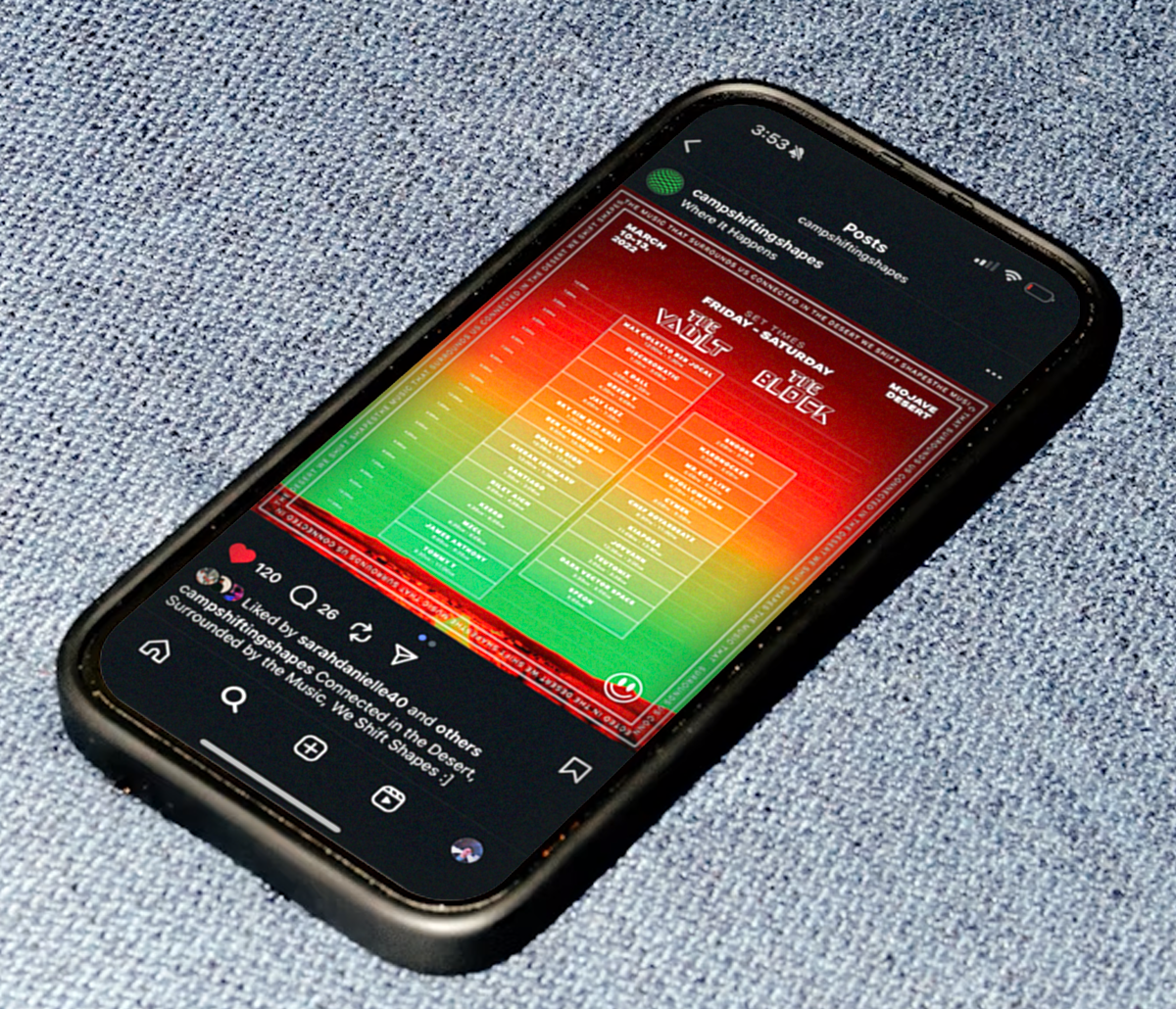 A smartphone displaying a colorful schedule or event timetable on a social media post, placed on a blue fabric surface.