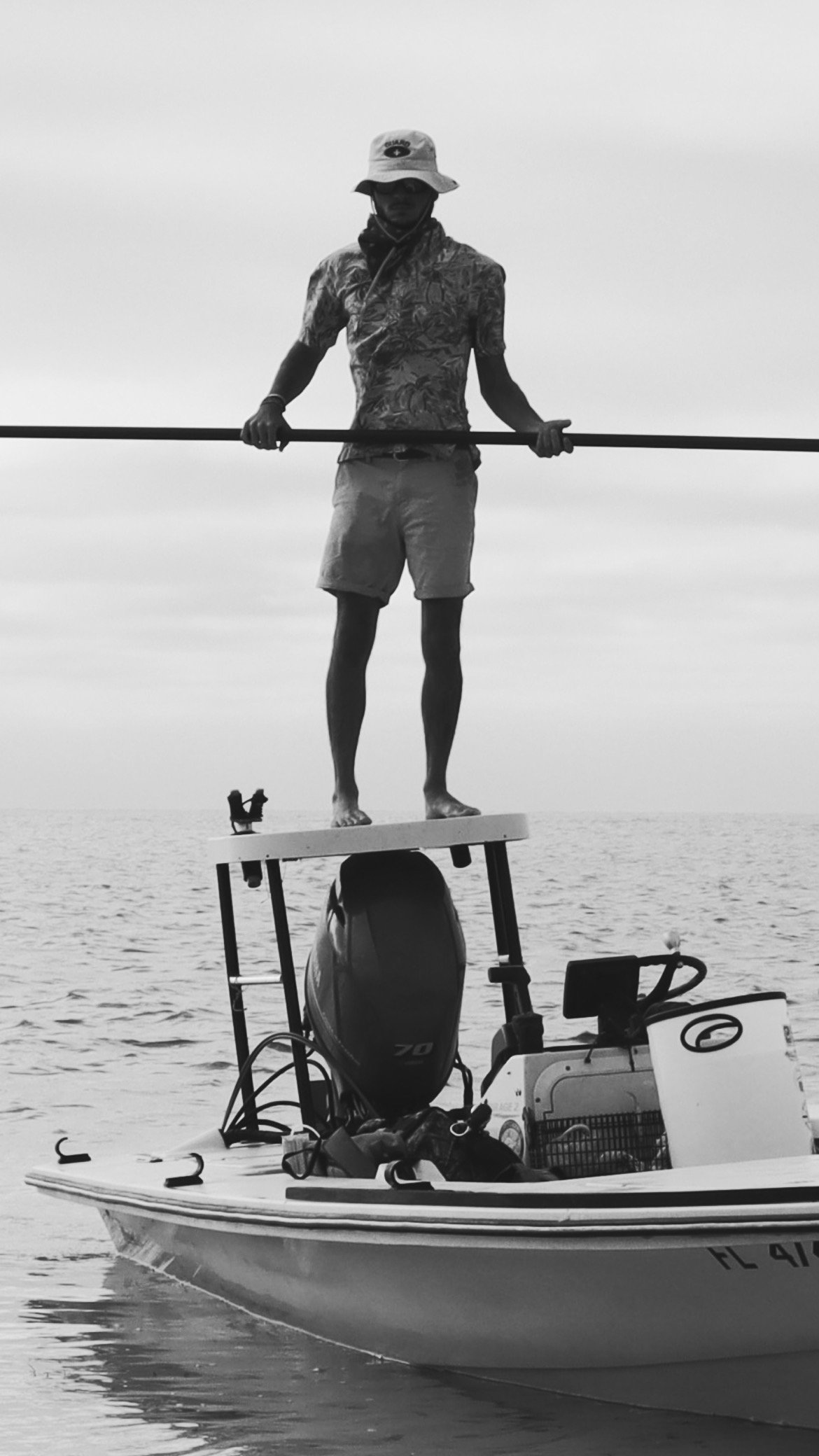 Black and white maverick poling skiff Captain Quinton DeStout