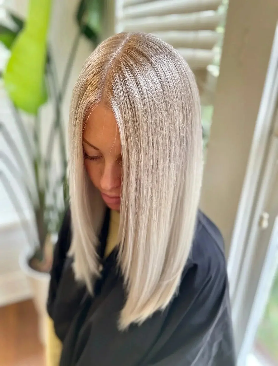 A finished precision cut on collarbone-length blonde hair at Clark & Company Salon
