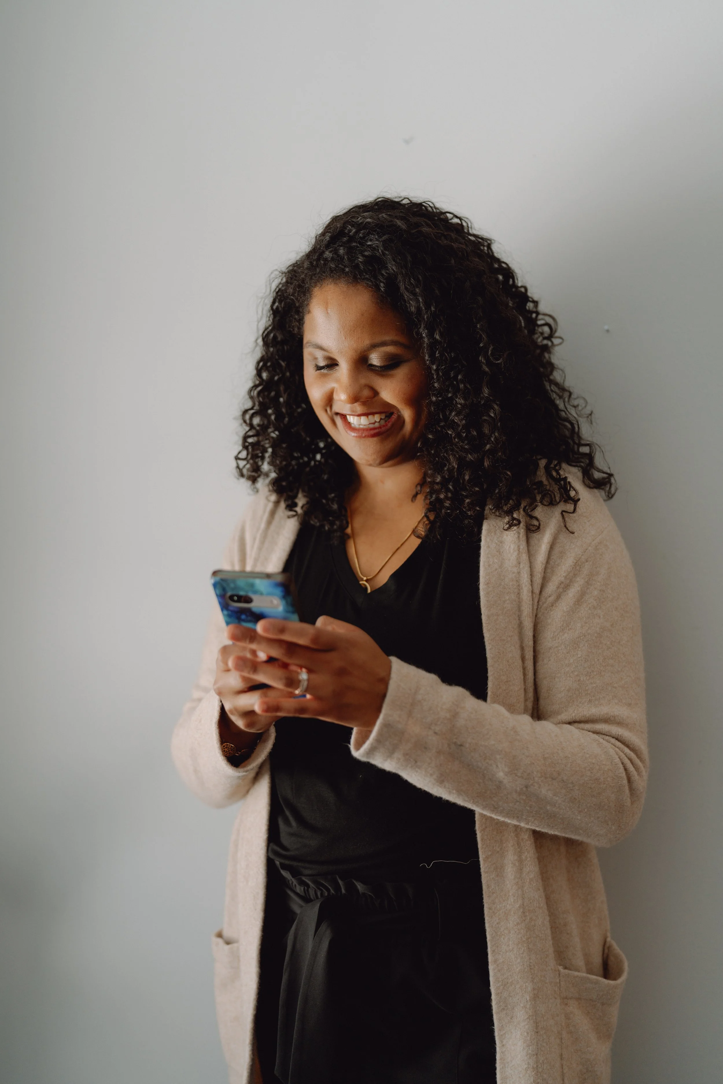 Therapist checking her phone for messages from her clients