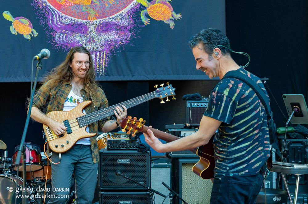 Bassist and guitarist under a tapestry at Monte Rio