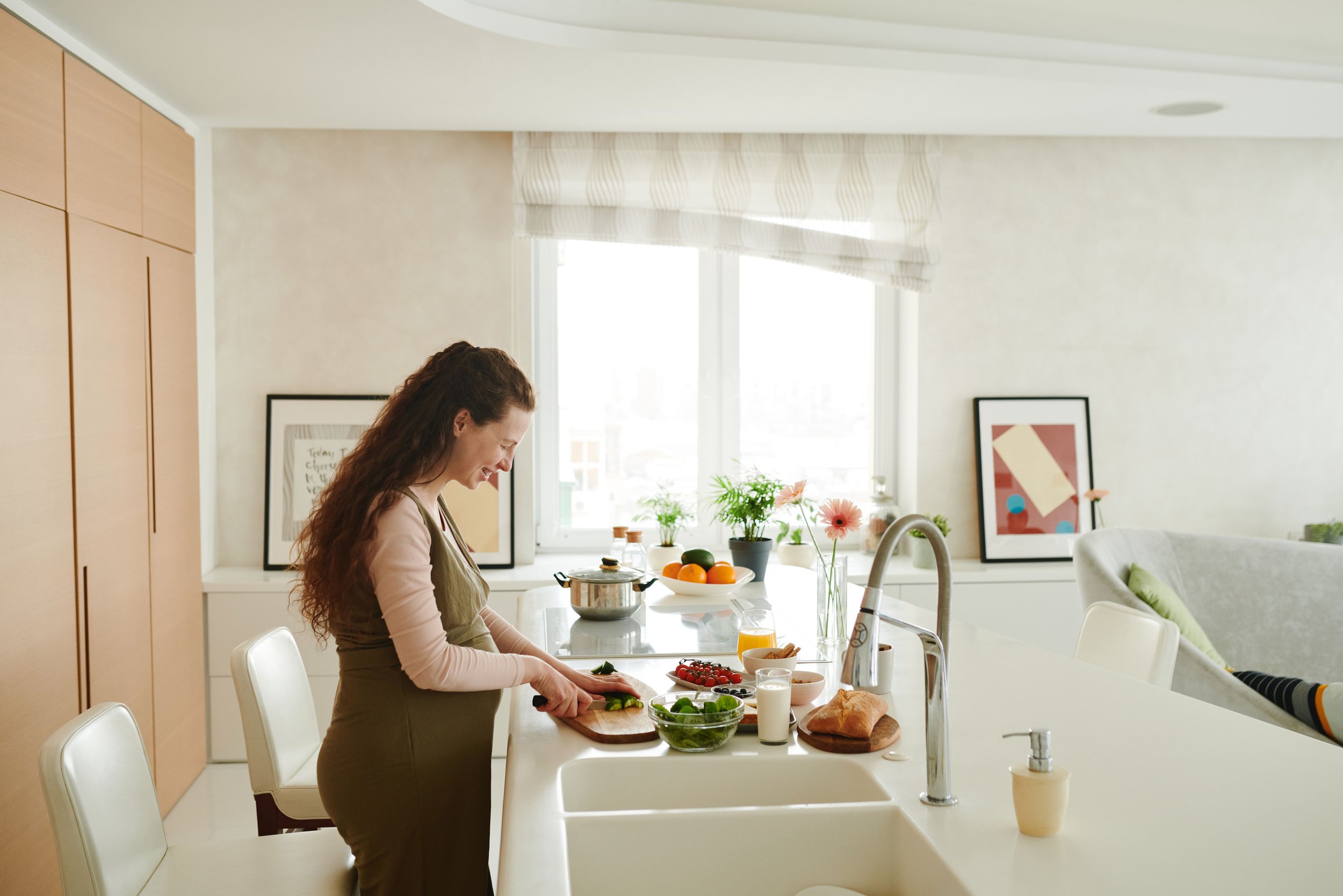 pregnant woman making nutritious food | The Sectional