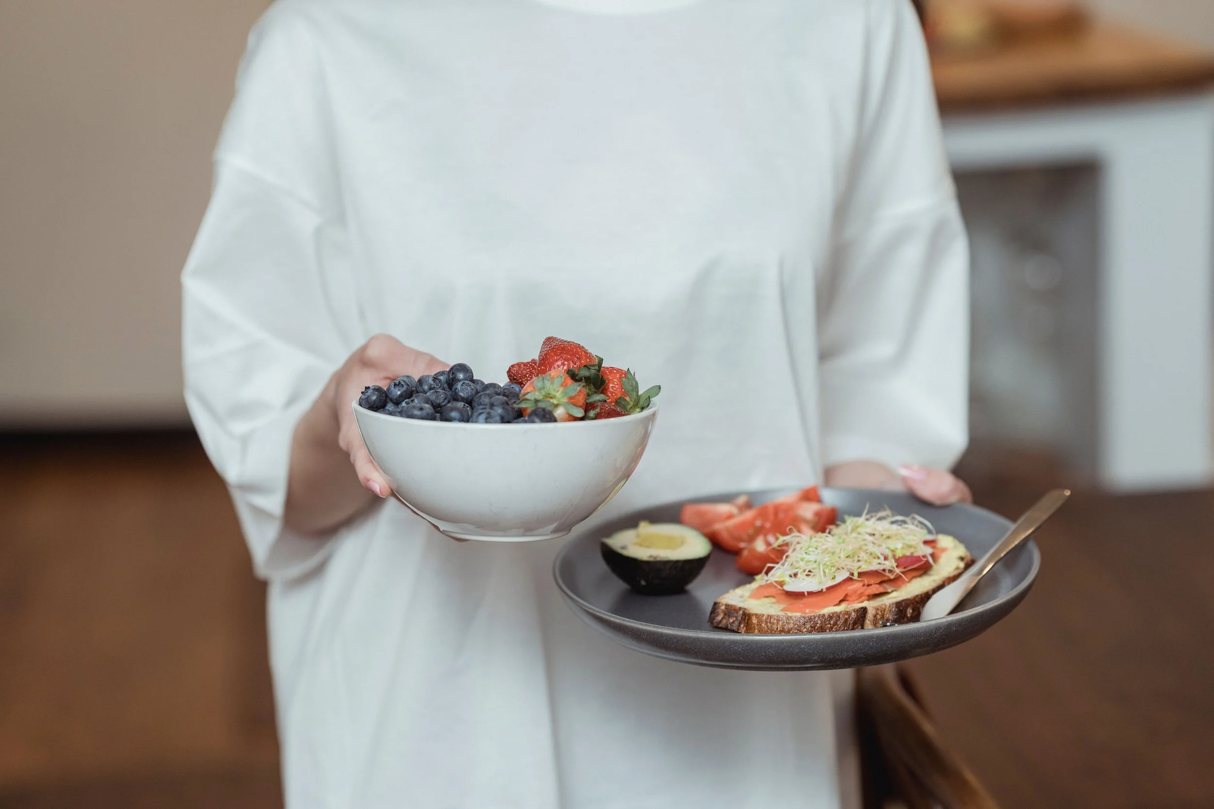 woman eating healthy food on her period cycle syncing | The Sectional