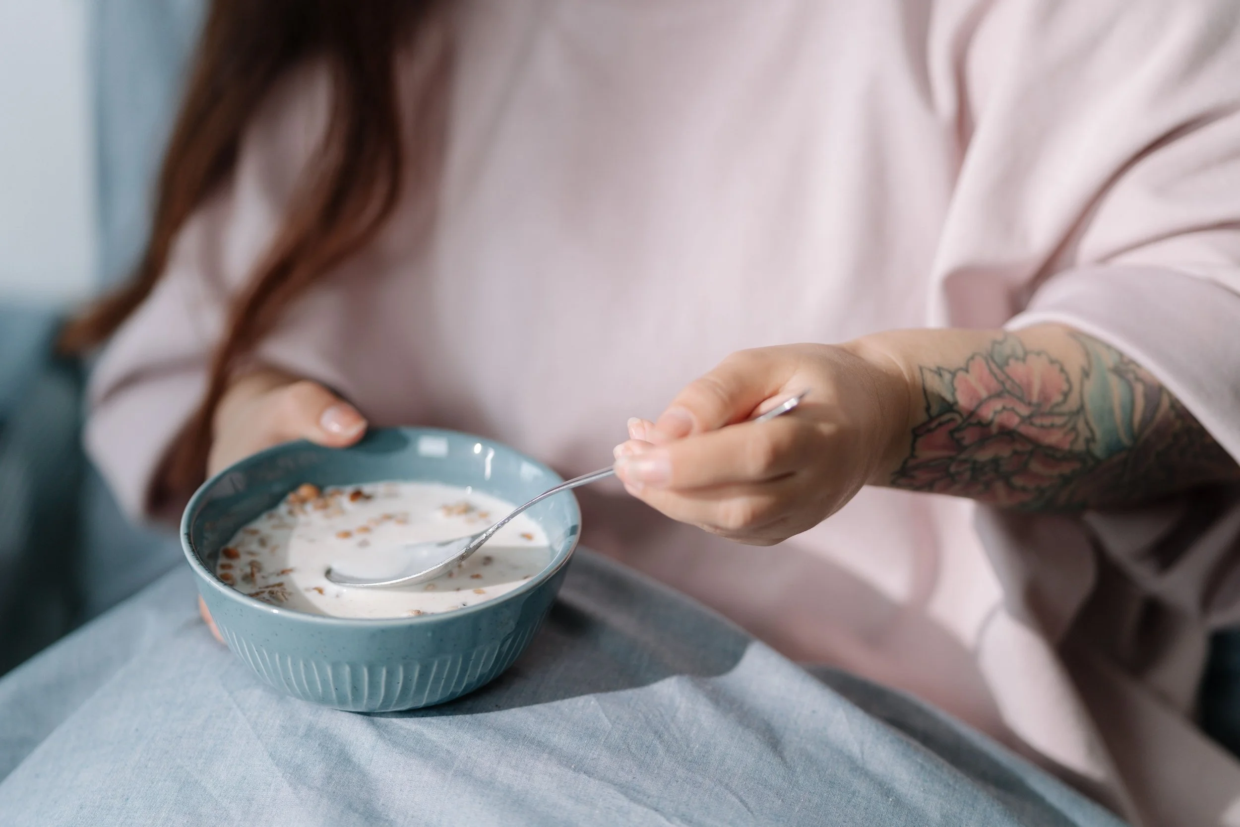 Pregnant woman eating cereal | The Sectional