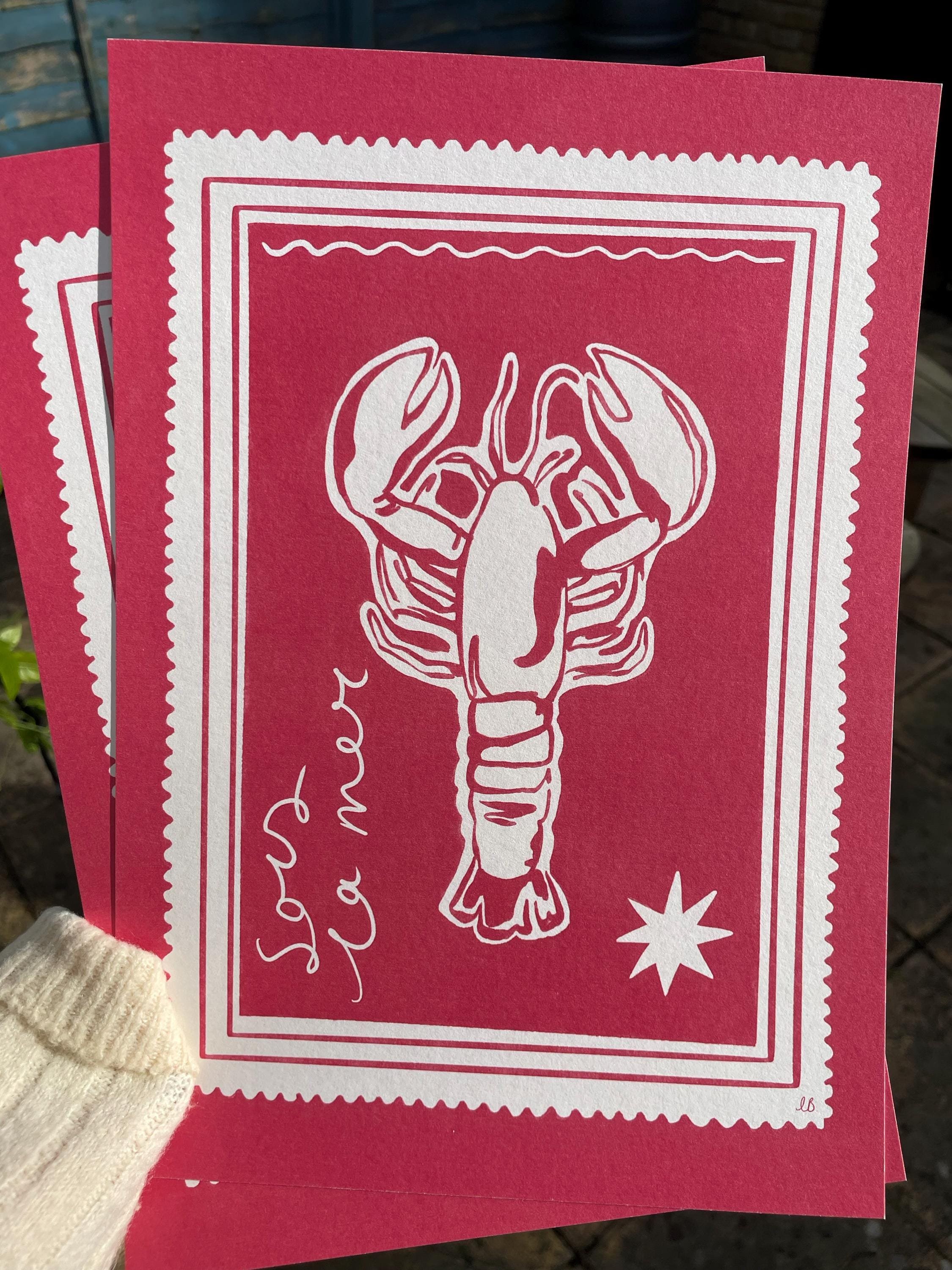 Pink wall art print featuring a lobster illustration and scalloped border, giving the print a bold, playful feel.