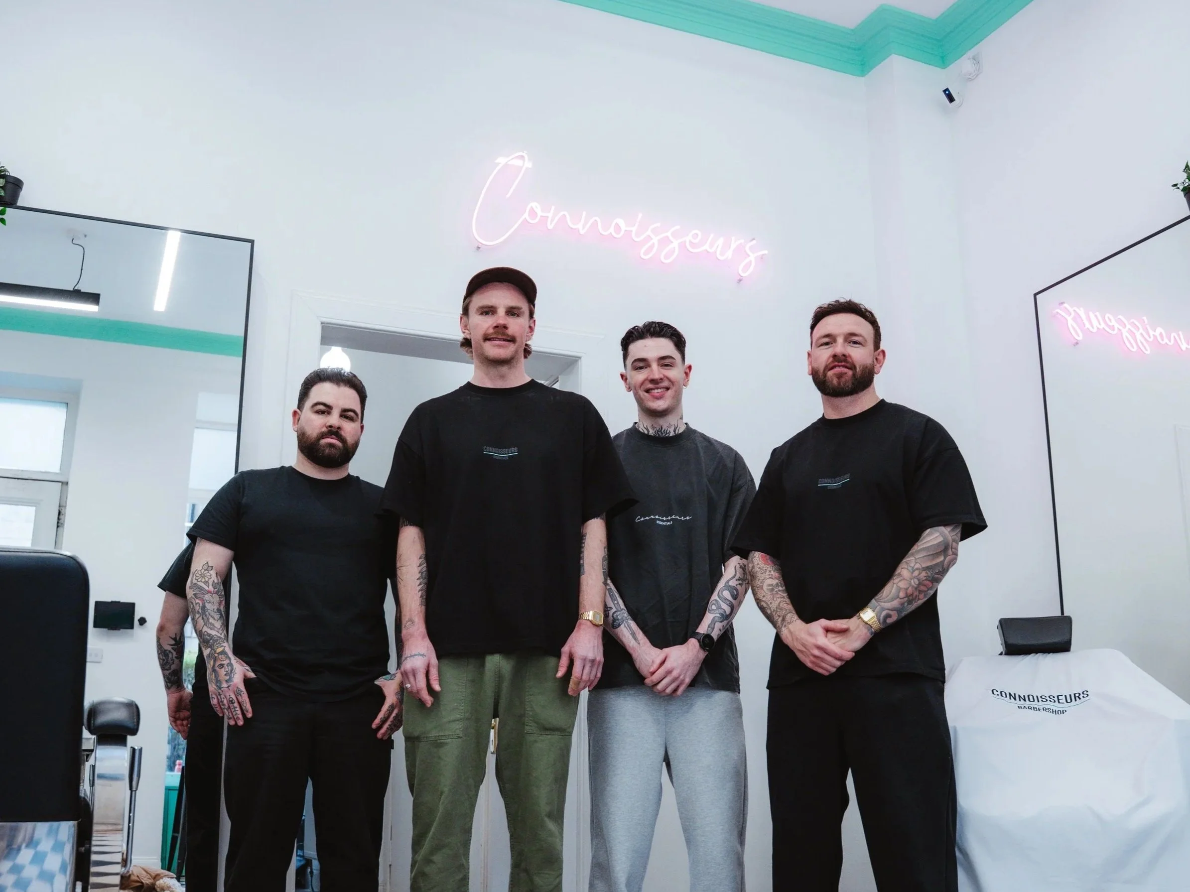 Team of barbers at Connoisseurs Barbershop in Left, Edinburgh
