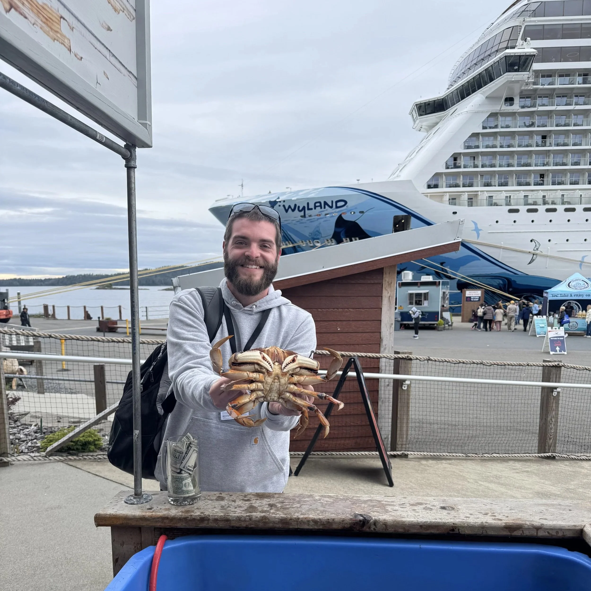 Me holding a crab at port in Sitka, Alaska.