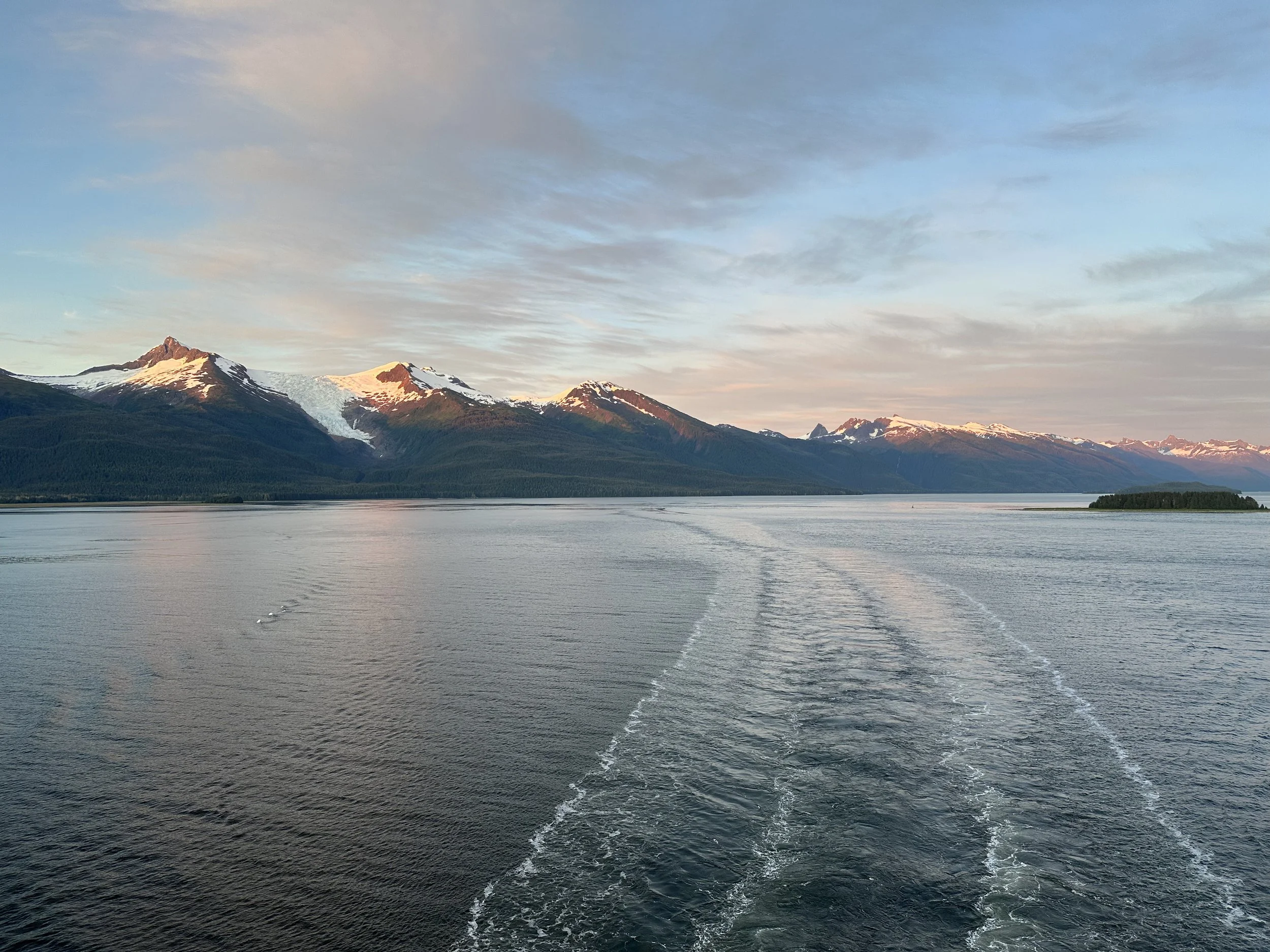 A sunset view facing aft from SpiceH2O aboard Norwegian Bliss.