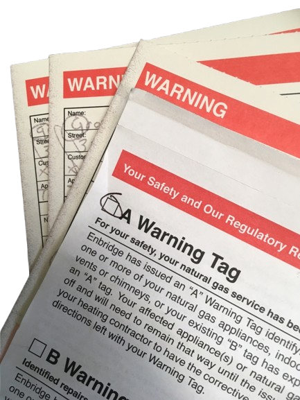 Close-up of warning labels on gas safety tags and certifications.