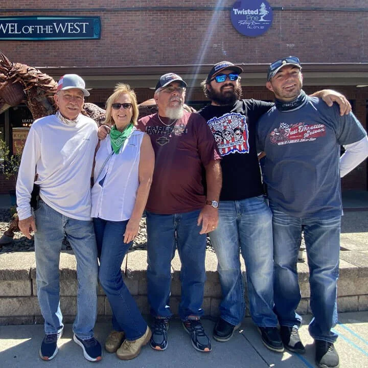 Bus'n Bikers Motorcoach and Motorcycle Club members group photo outside Twisted Pine restaurant during club ride.
