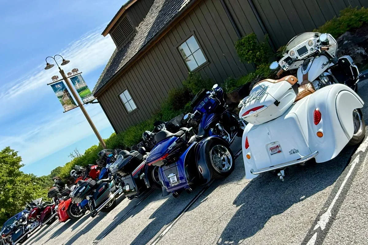 Bus 'n Bikers motorcycles lined up in Top of the Rock Heritage Preserve 