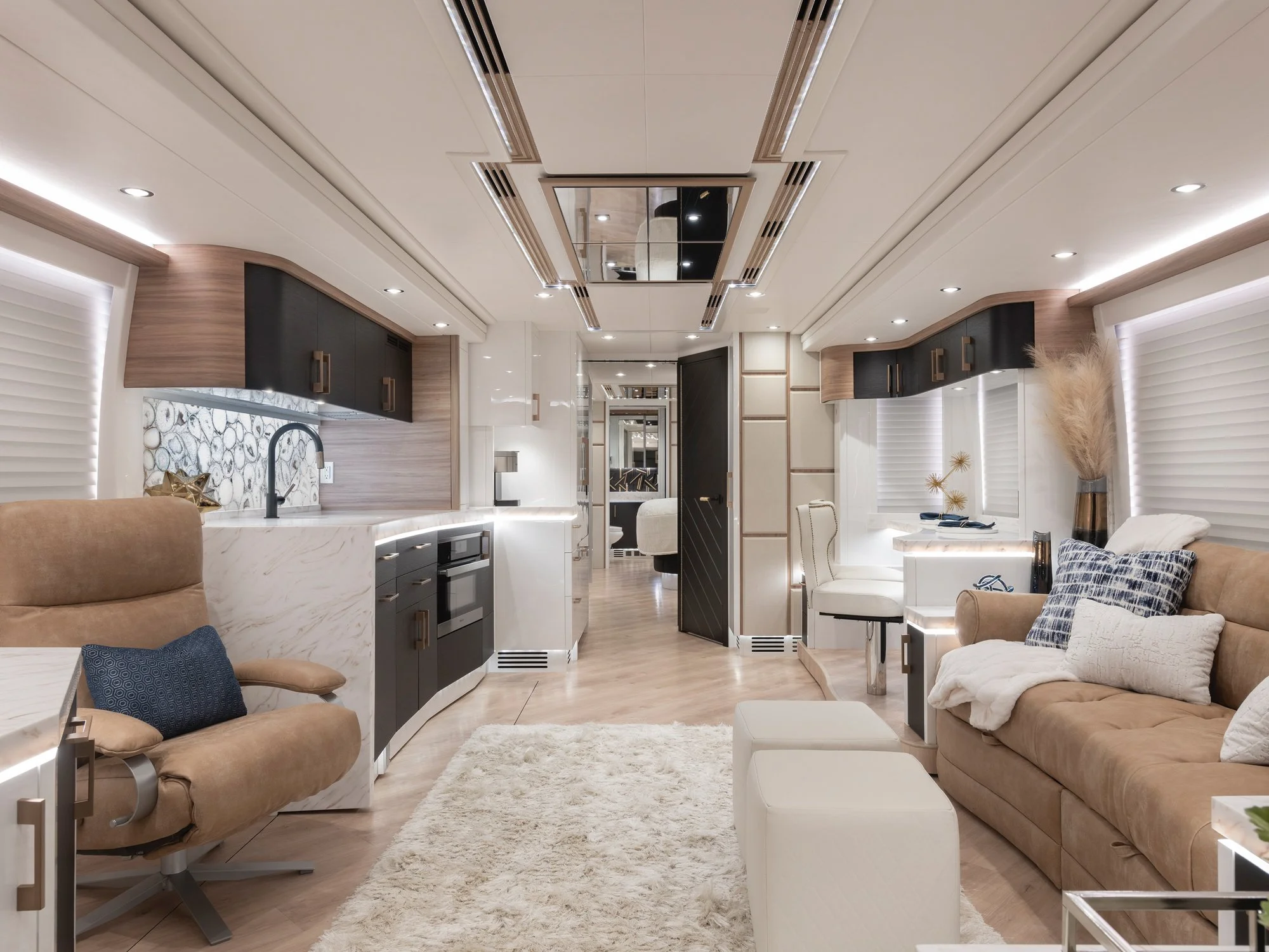 Liberty Coach interior, showing a sitting area, kitchen and dining bar.