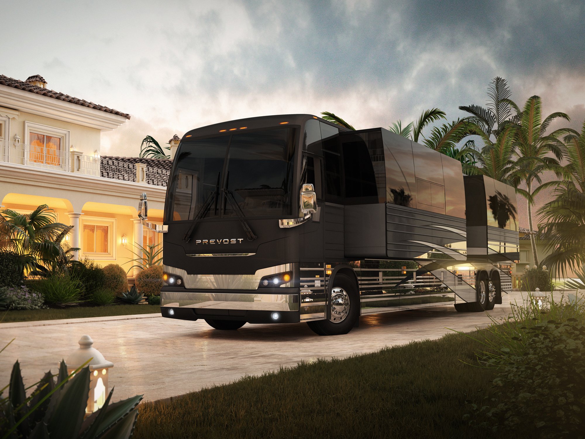 Prevost luxury motorcoach in front of an upscale home at sunset, highlighting slide-outs and premium design features.