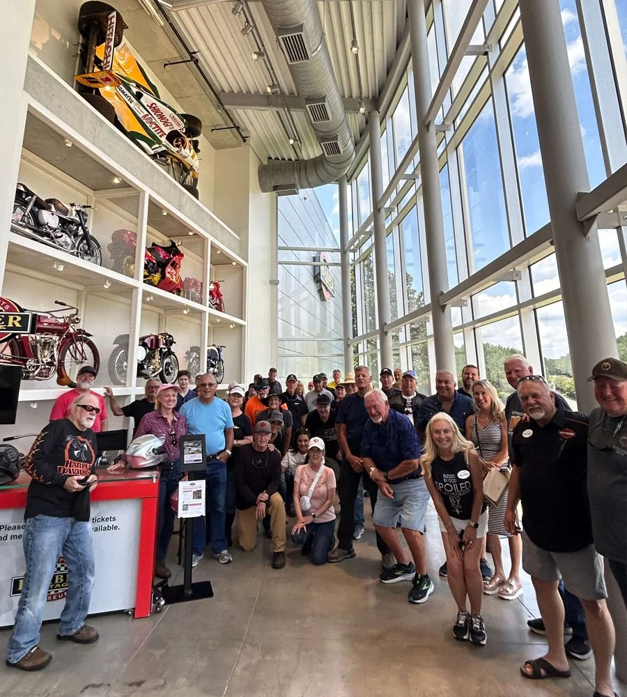 Bus'n Bikers members standing together for a group photo at the Barber Museum.