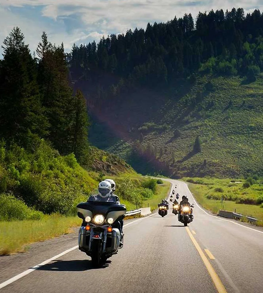 A group of motorcyclists riding in the Blue Ridge Mountains.
