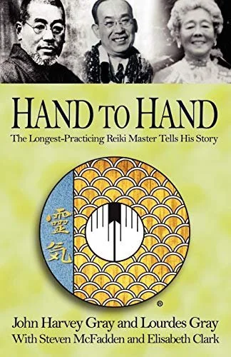 Book cover titled 'Hand to Hand: The Longest-Practicing Reiki Master Tells His Story' by John Harvey Gray and Lourdes Gray with Steven McFadden and Elisabeth Clark, featuring a black and white photo of three smiling people at the top and a circular Reiki symbol in the center with decorative background.