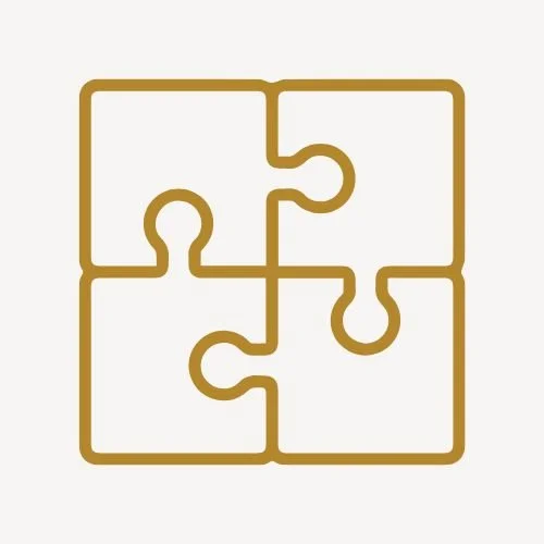 Outline of four interlocking puzzle pieces forming a square, symbolizing multiple identities in therapy, drawn with a simple gold line on white.