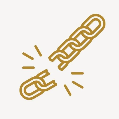 A gold-colored chain with a broken link in the middle, symbolizing therapy from a decolonized perspective