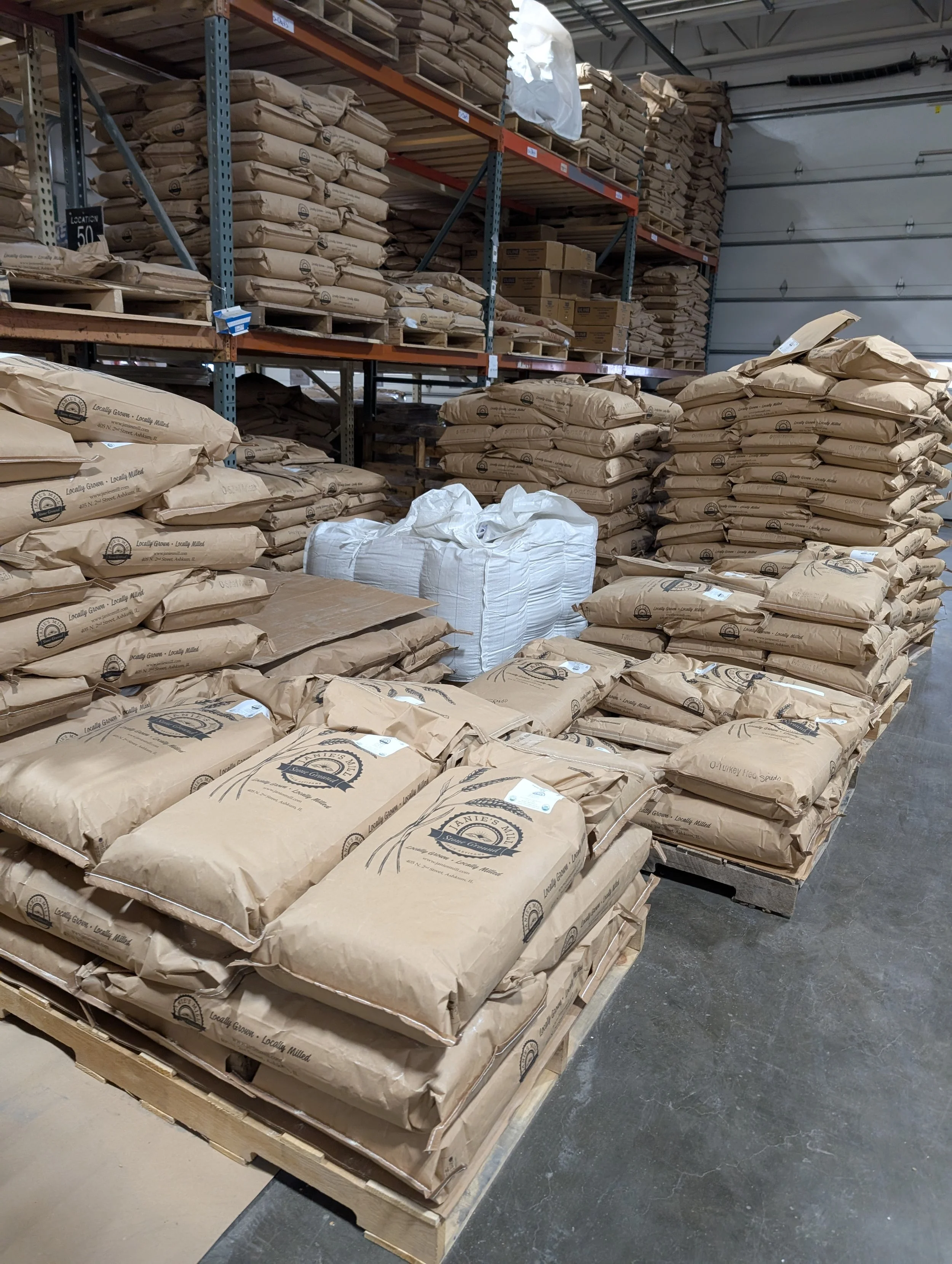 White flour is typically 70-80% extraction, which means enough bran and germ have been sifted out, that only about 70-80% of the original kernel weight remains. 
Conversely, 100% whole wheat is 0% extraction, which means no bran or germ have been rem