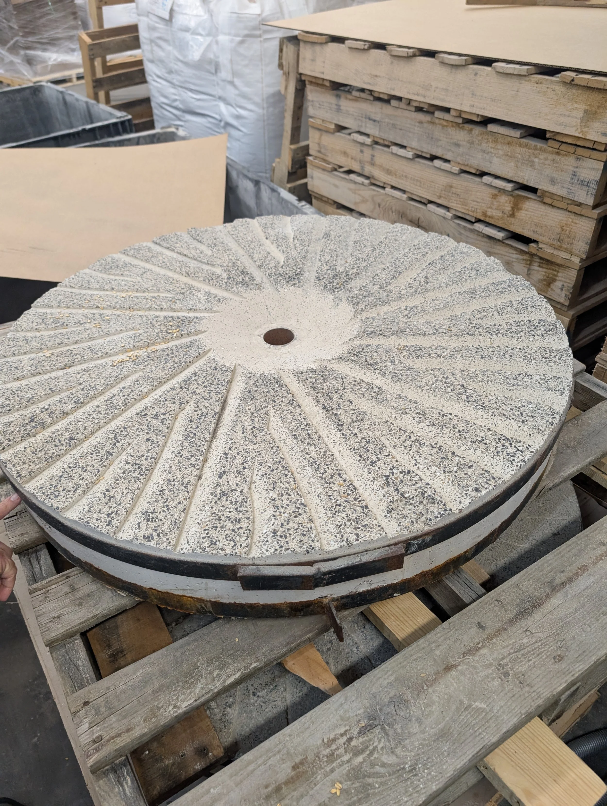 Flour is ground between two 500lb stones. The top one is stationary, the bottom one rotates. The distance between the stones determines how fine the grain will be. The millers listen to the grinding, to ensure the stones are set right. They can hear 