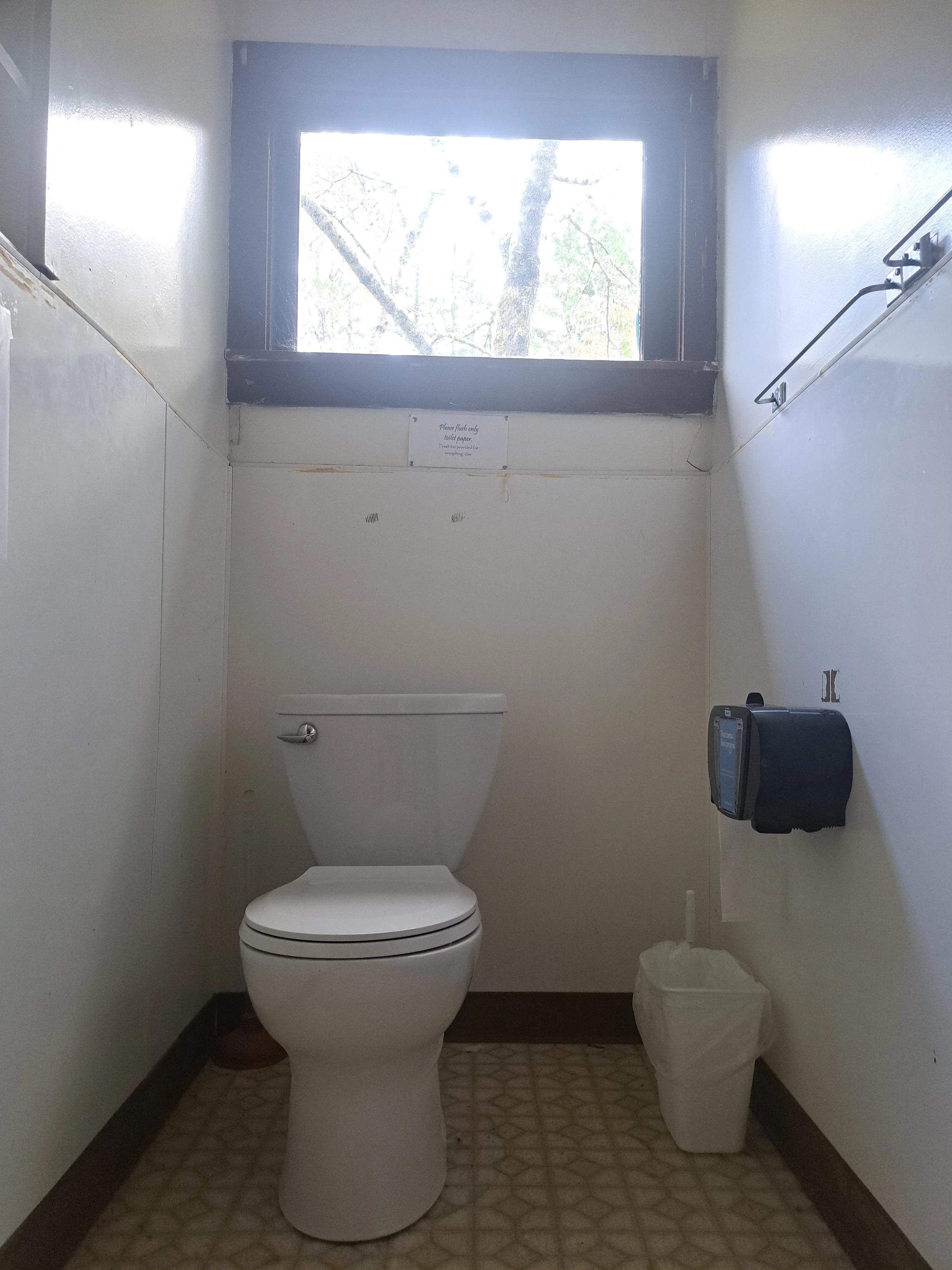 small cabin restroom with shower stall