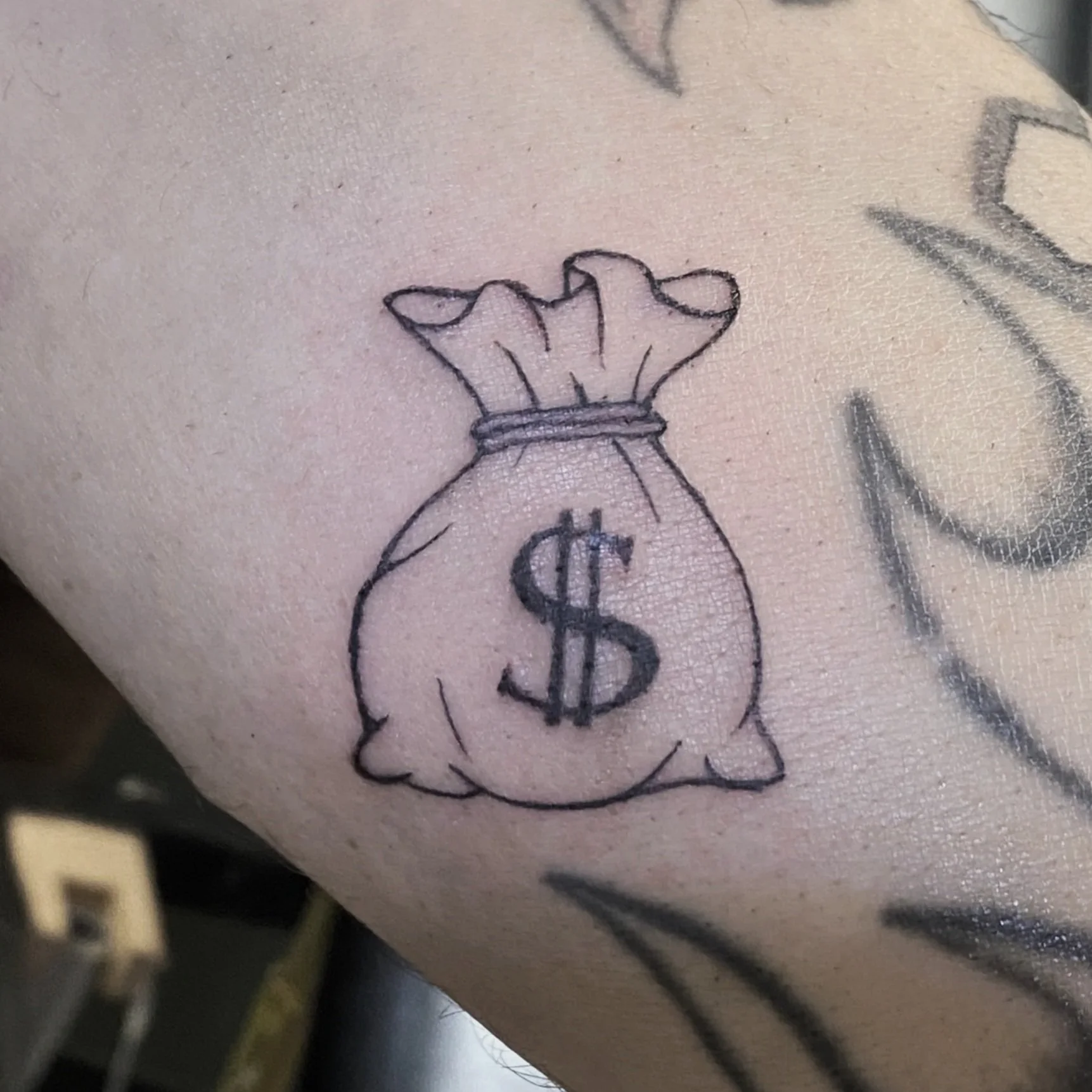 carlee grace tattoos hoscton ga north georgia tattoo artist winder braslton homer buford money bag simple small minimal mens man masculine