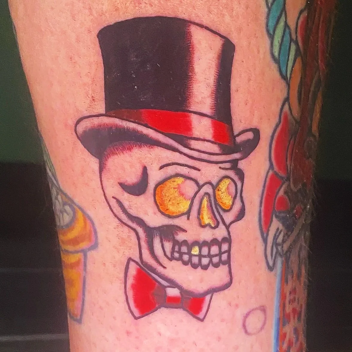 carlee grace tattoos hoscton ga north georgia tattoo artist winder braslton homer buford American traditional skull top hat bow tie color carlee grace tattoos