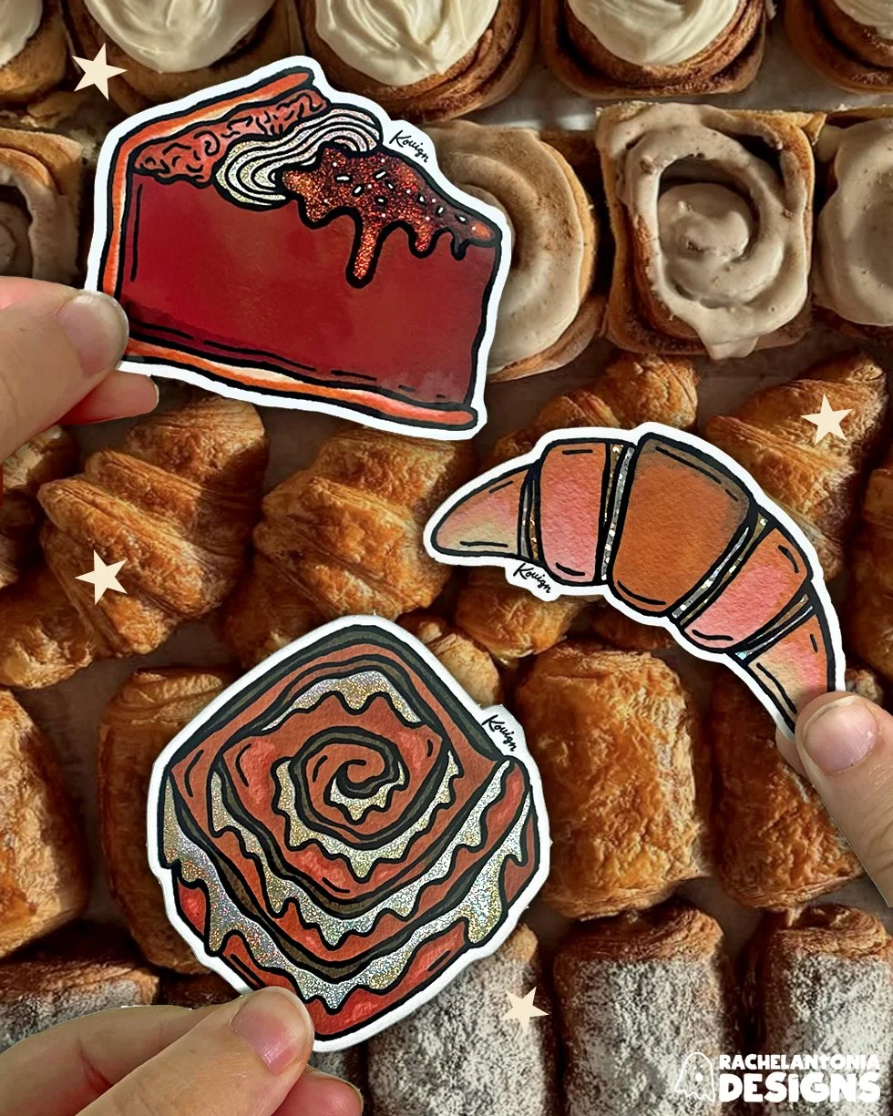 Stickers complete with glitter detail and logo hovering over the Kouign pastry case