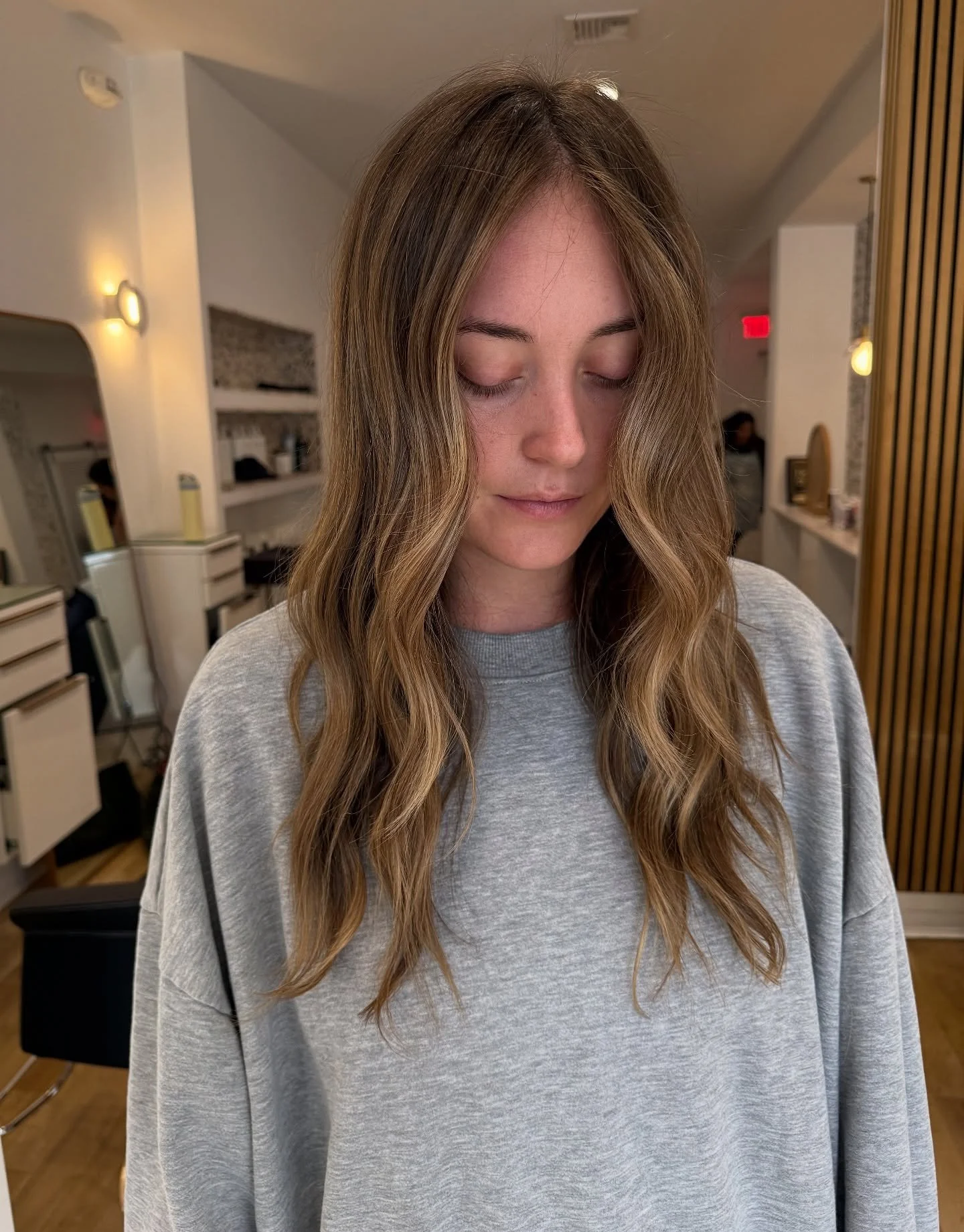 Took this beauty a little darker and closer to her natural color ✨

Soft lowlights, subtle highlights, and a gloss to keep her looking sun-kissed and dimensional &mdash; the perfect fall transition tone!

Are you a blondie looking to deepen your colo