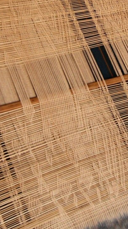 Close-up of woven straw or bamboo material, possibly part of a basket or mat.