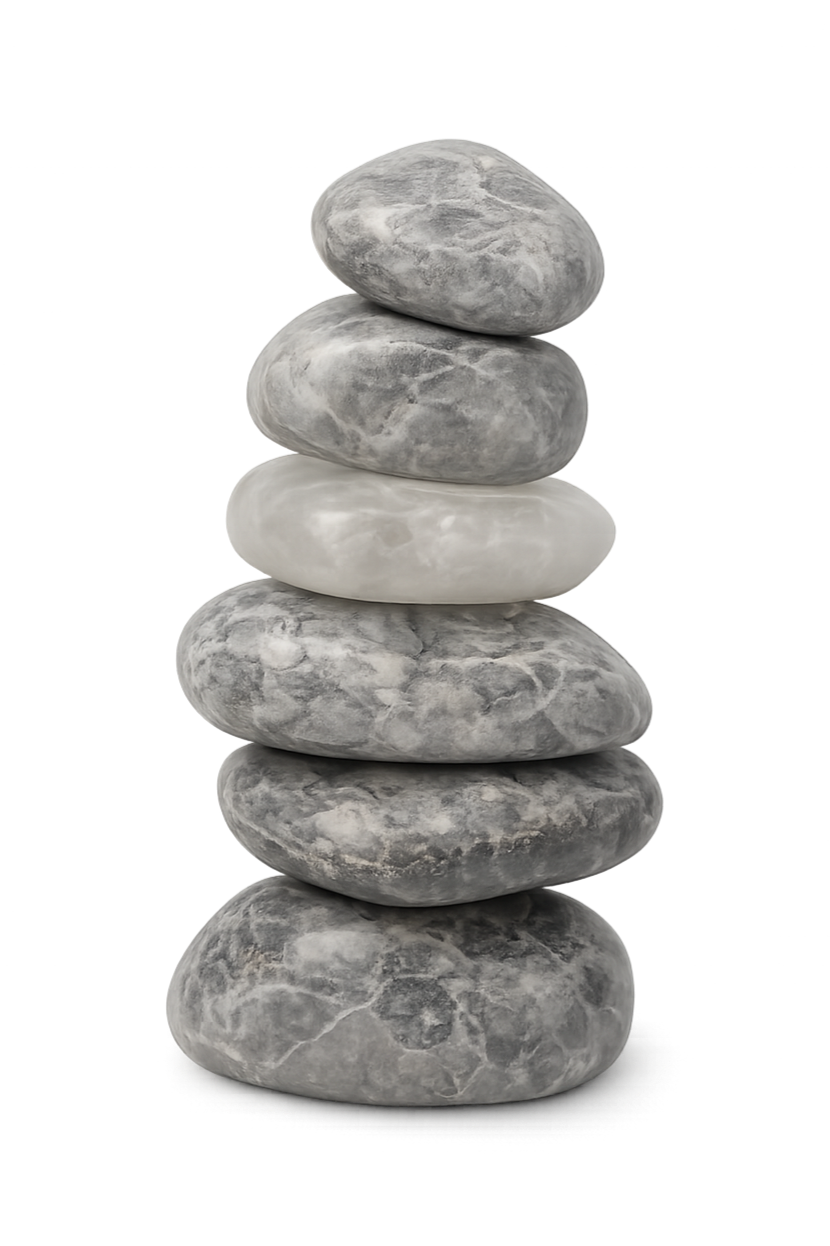 Stack of five smooth, rounded gray stones with one white stone in the middle, against a black background.