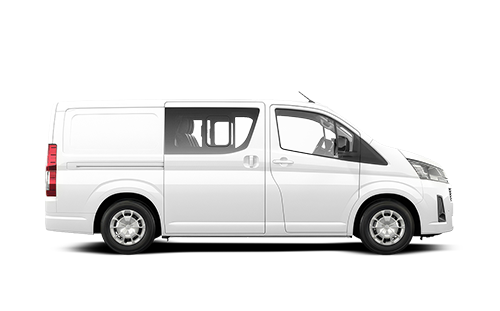 Side view of a white cargo van with tinted windows in a studio setting.