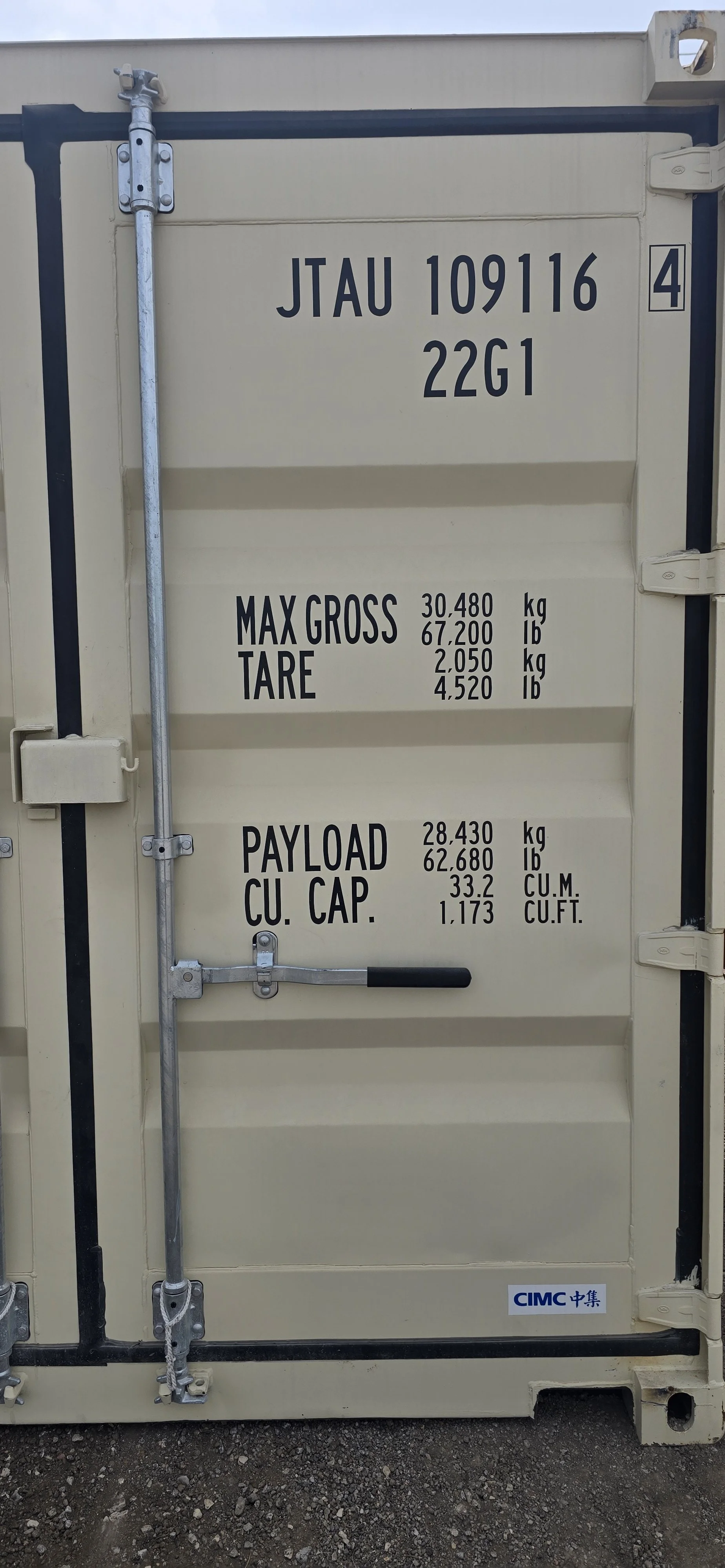 Detailed close-up of shipping container door hinge and locking bars showing easy open door hardware.