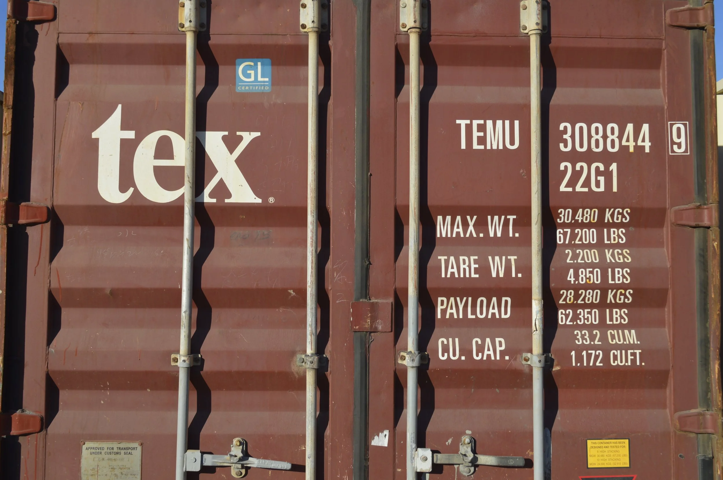 Close-up of double door locking mechanism on a used 20 ft steel storage container in Fort Worth, TX, showing durable hardware and solid construction.