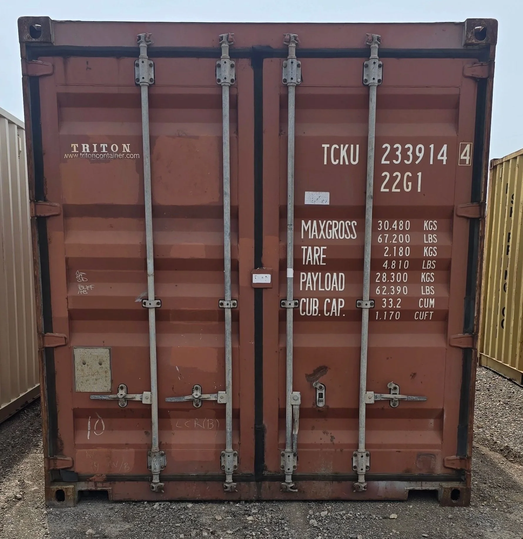Brownish red used 20ft shipping container front view with closed double doors