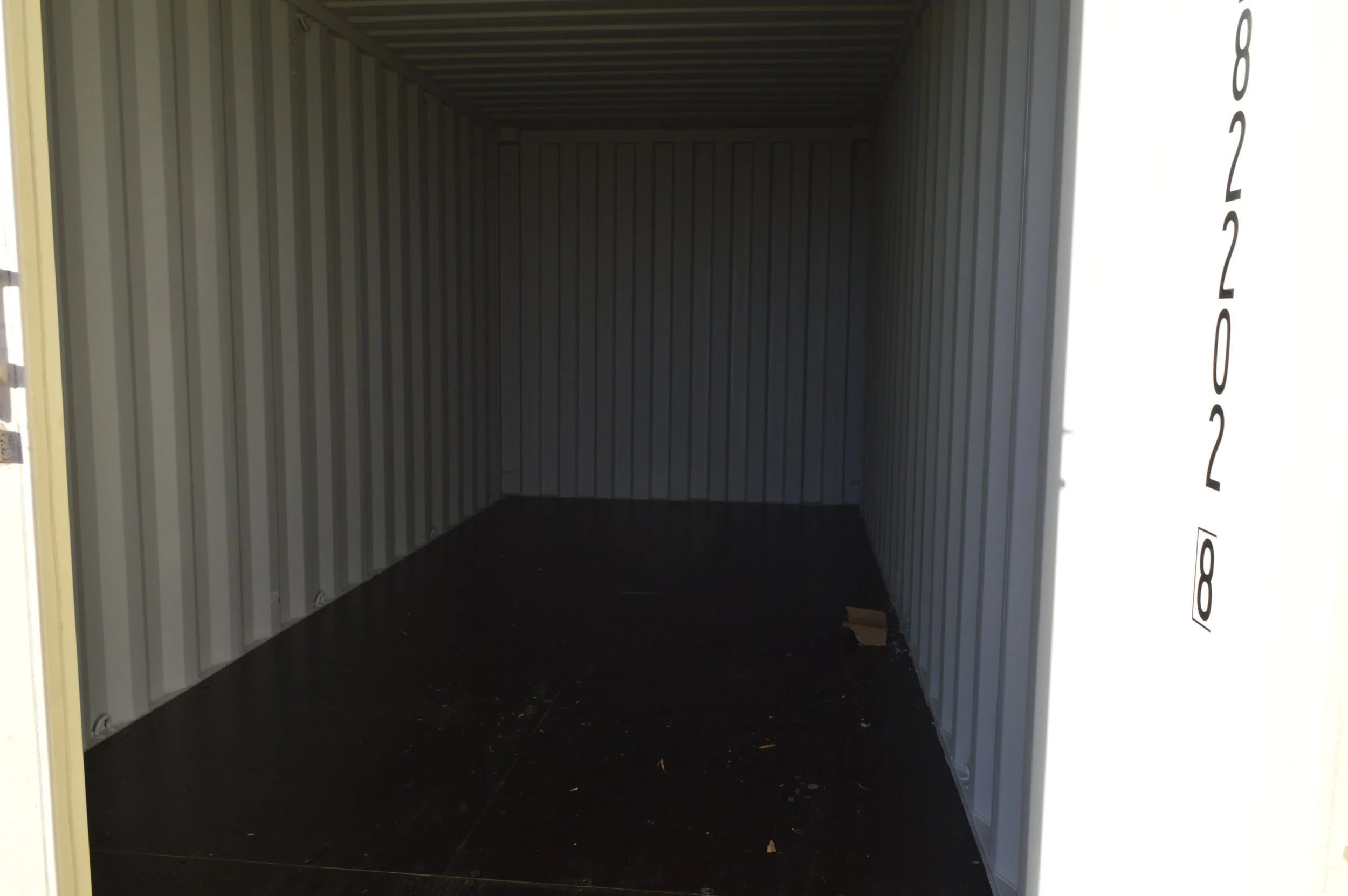 Interior of a one trip 20 ft storage container with steel walls and solid flooring, ideal for equipment or jobsite storage in Fort Worth, Texas.