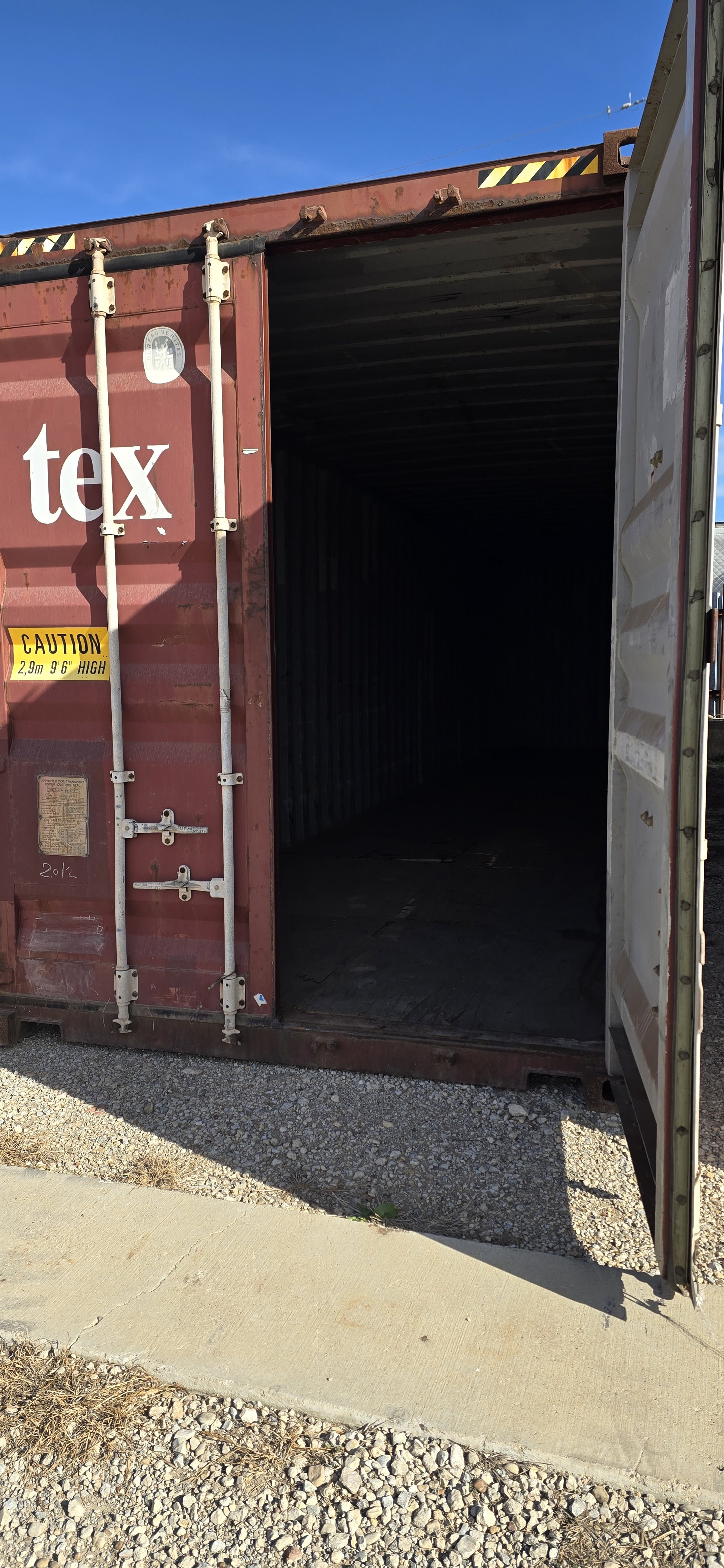 Open door view of a used 40 ft storage container in Fort Worth, TX showing clean steel interior and solid wood flooring.