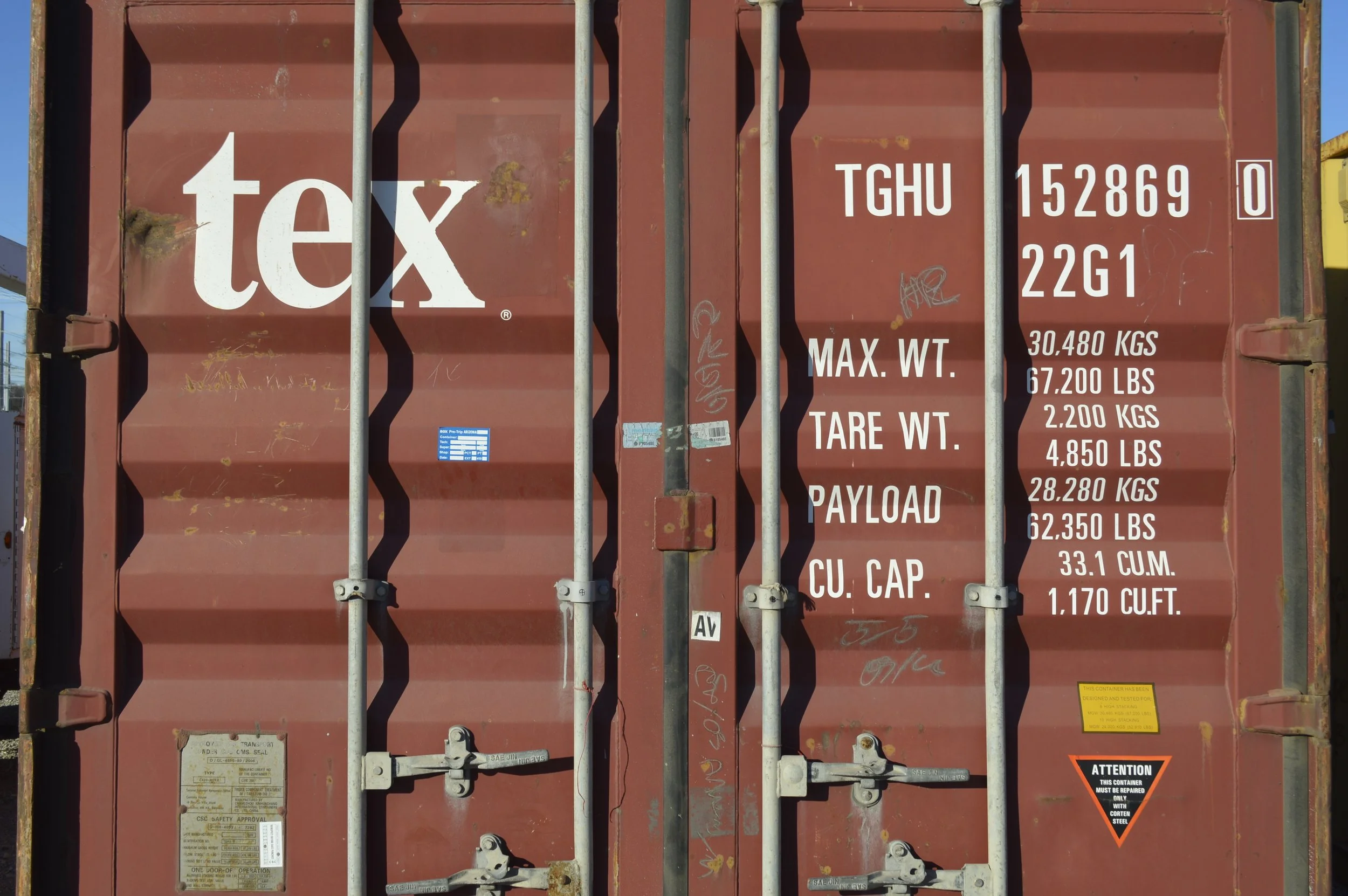 Close-up of double door locking mechanism on a used 20 ft steel storage container in Fort Worth, TX, showing durable hardware and solid construction.