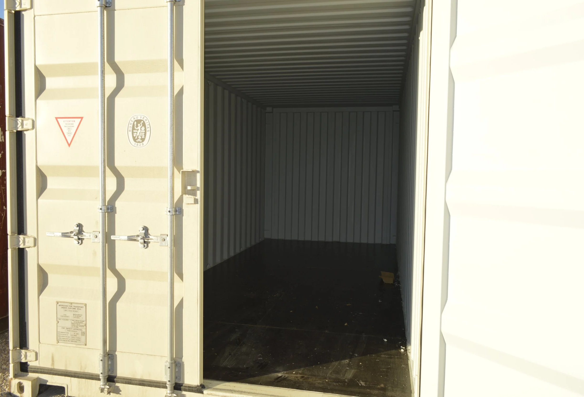 Open door view of a one trip 20 ft storage container in Fort Worth, TX showing clean steel interior and solid wood flooring.