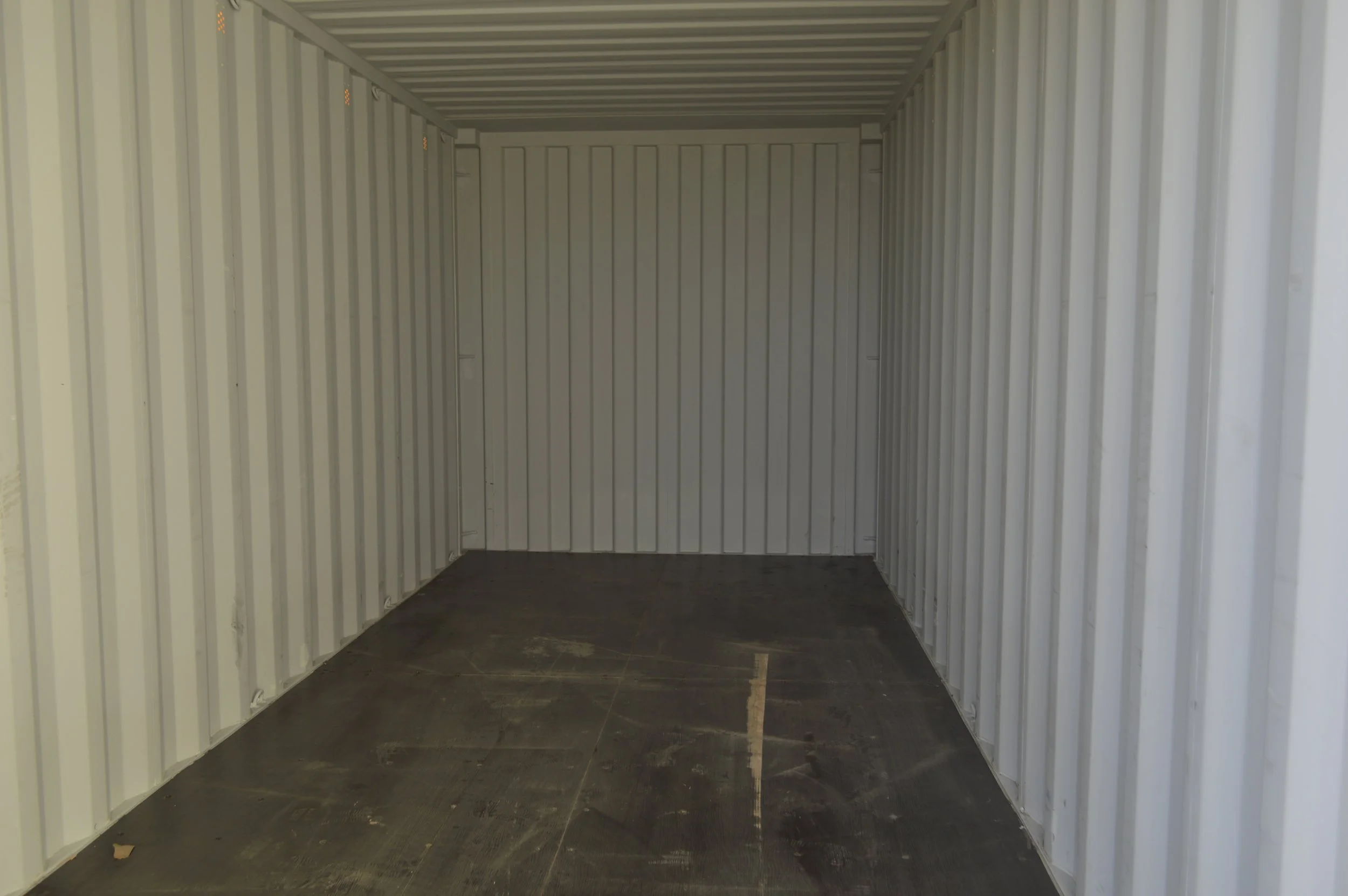 Interior of a one trip 20 ft storage container with steel walls and solid flooring, ideal for equipment or jobsite storage in Fort Worth, Texas.