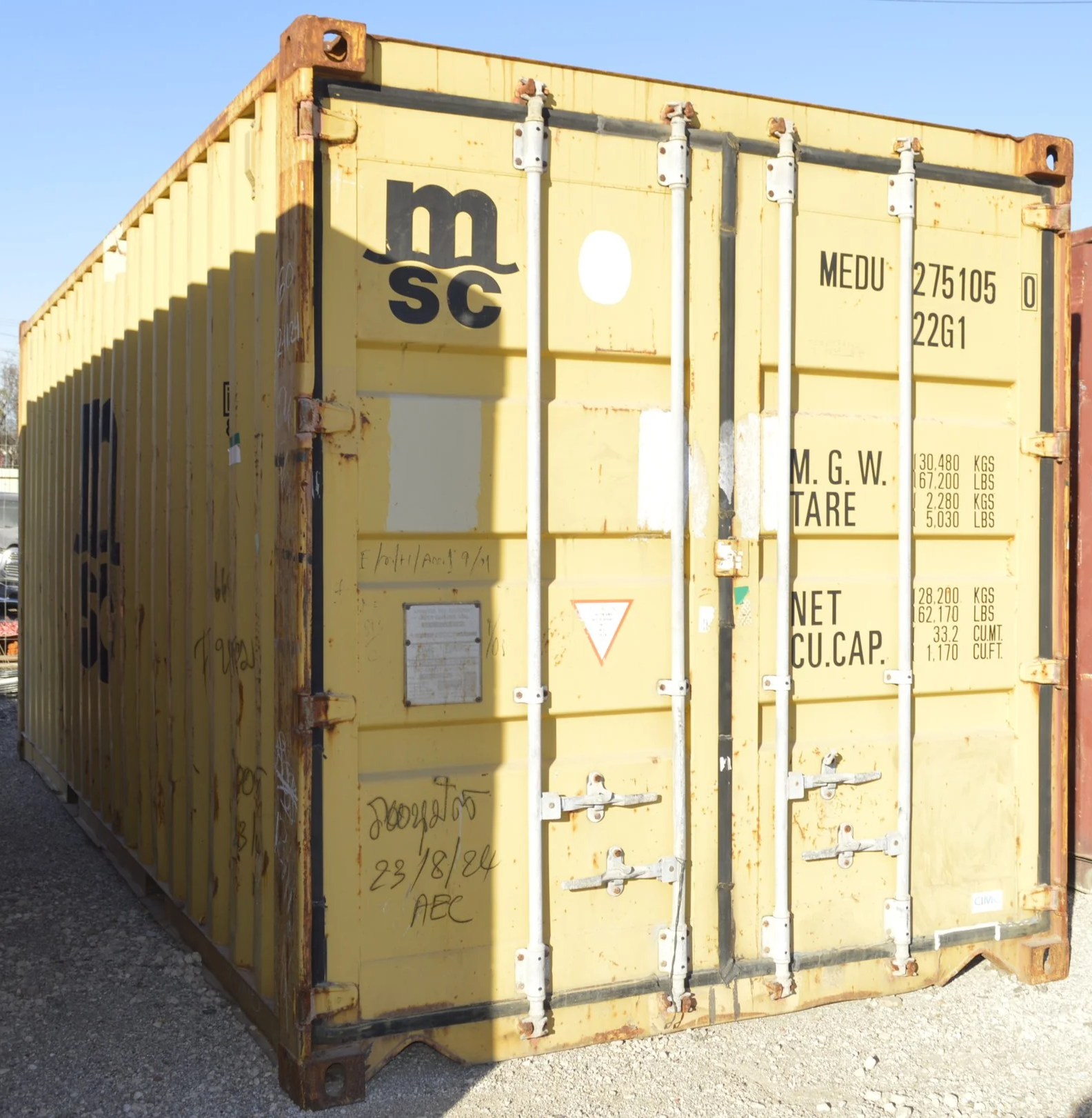Used 20 ft storage container in Fort Worth, TX with yellow steel exterior, double swing doors, and visible corner casting. Wind and water tight condition.