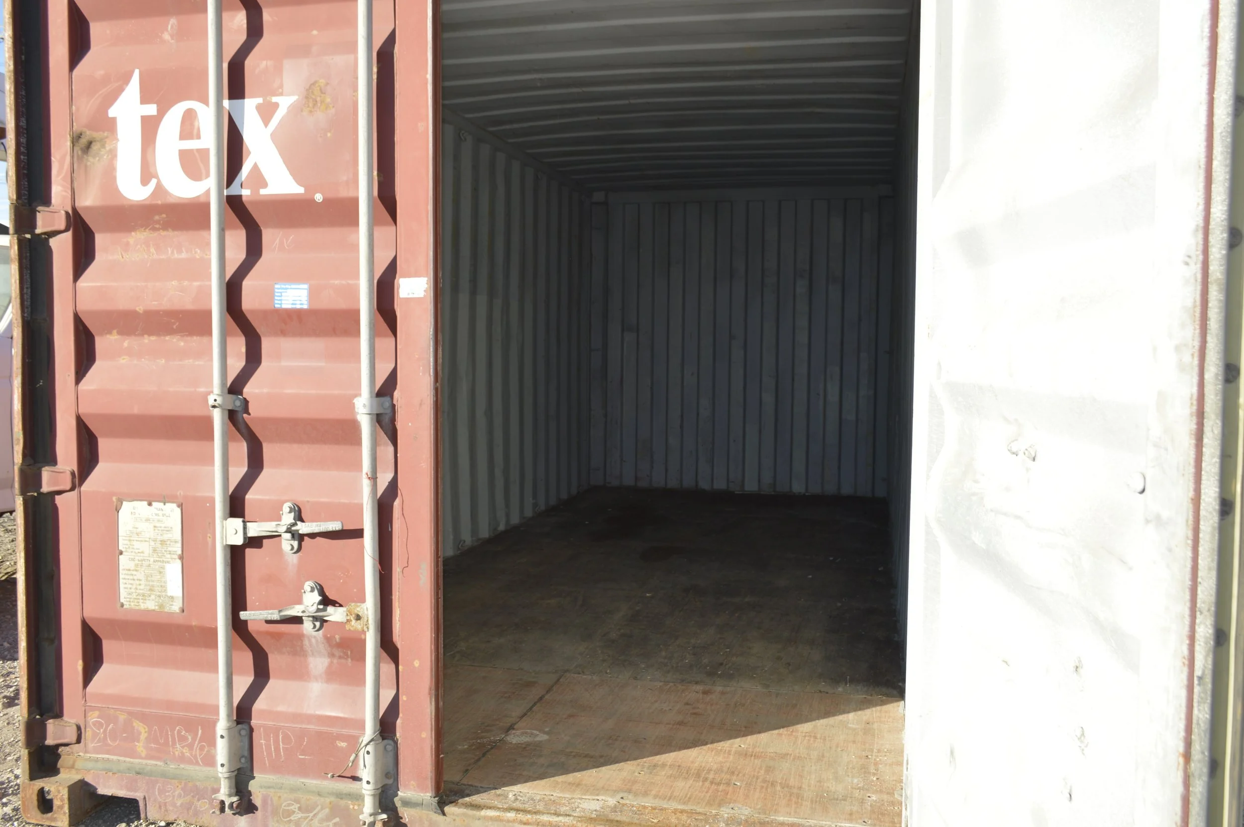 Interior of a used 20 ft storage container with steel walls and solid flooring, ideal for equipment or jobsite storage in Fort Worth, Texas.