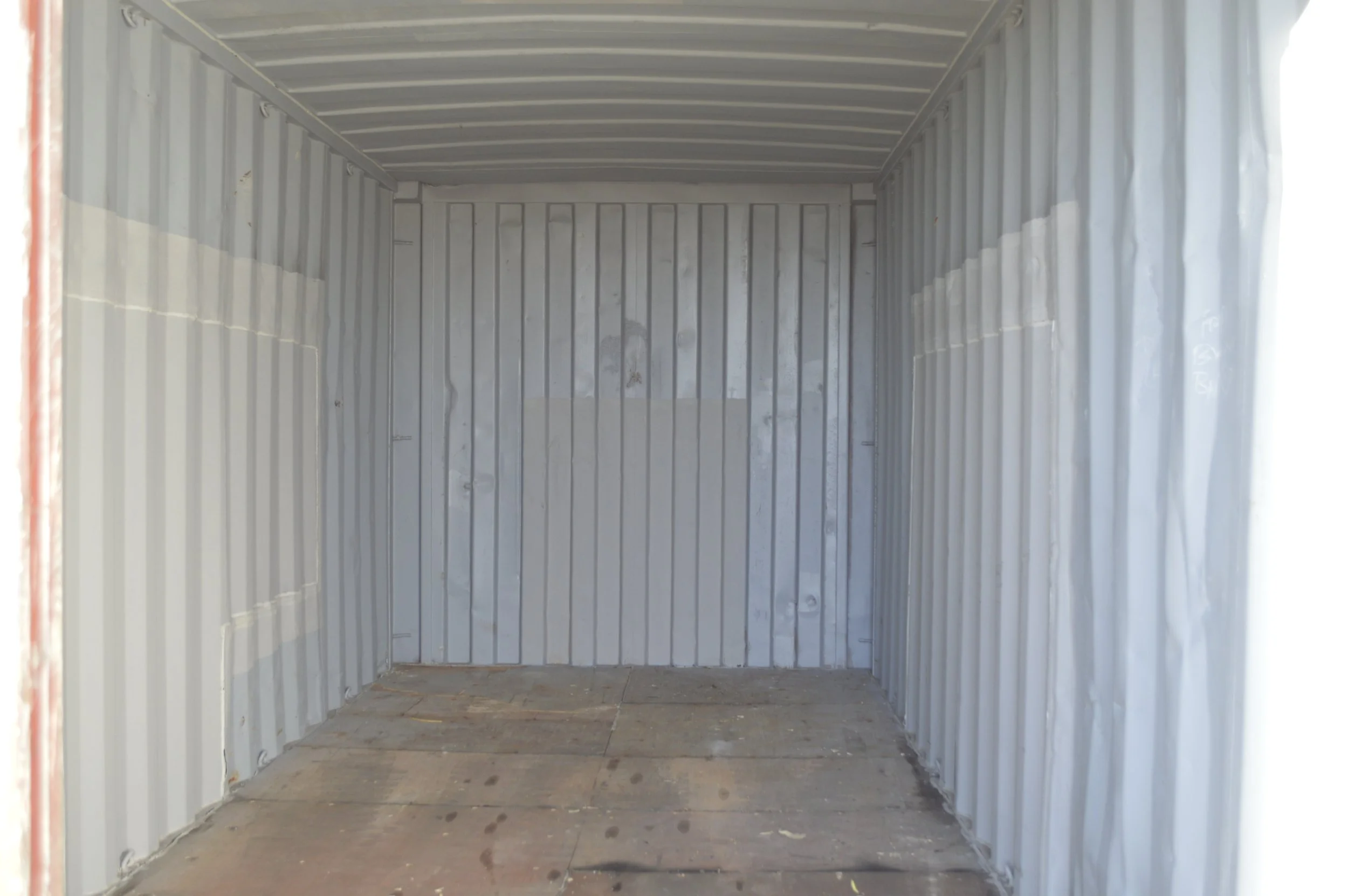 Interior of a used 20 ft storage container with steel walls and solid flooring, ideal for equipment or jobsite storage in Fort Worth, Texas.