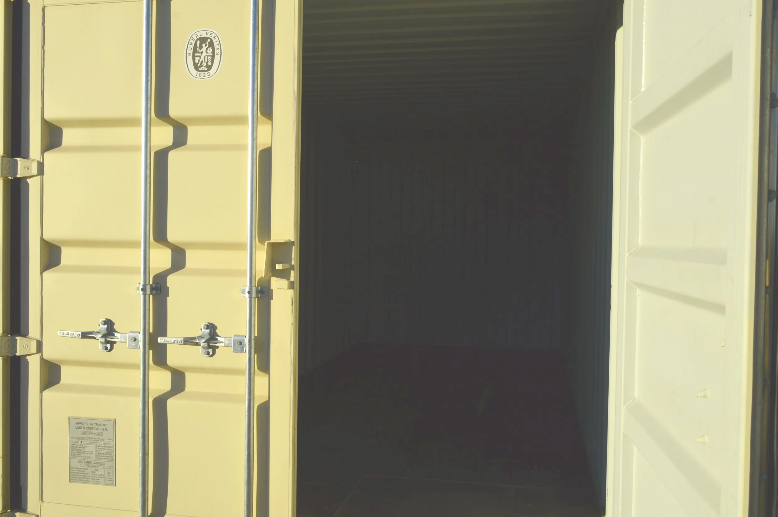 Open door view of a one trip 20 ft storage container in Fort Worth, TX showing clean steel interior and solid wood flooring.