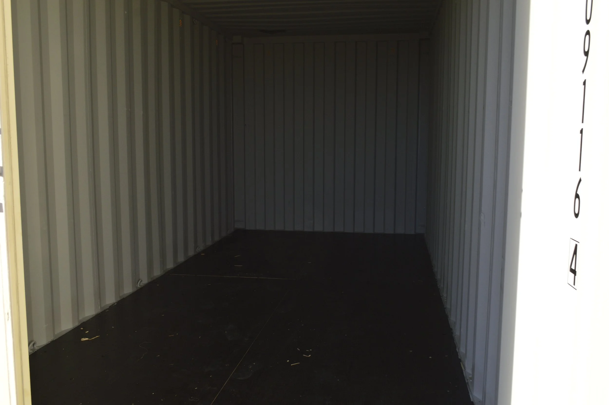 Interior of a one trip 20 ft storage container with steel walls and solid flooring, ideal for equipment or jobsite storage in Fort Worth, Texas.